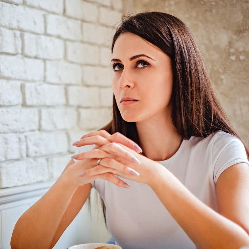 disassociating woman zoning out while talking to someone