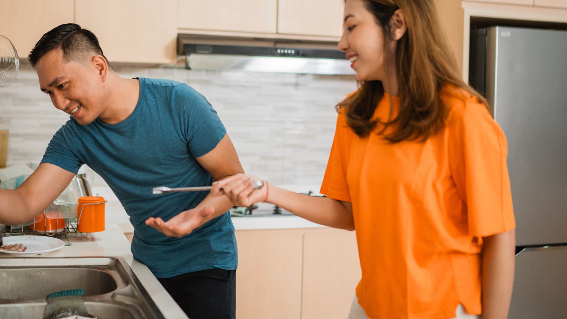 man doing a quick fix on sink for woman