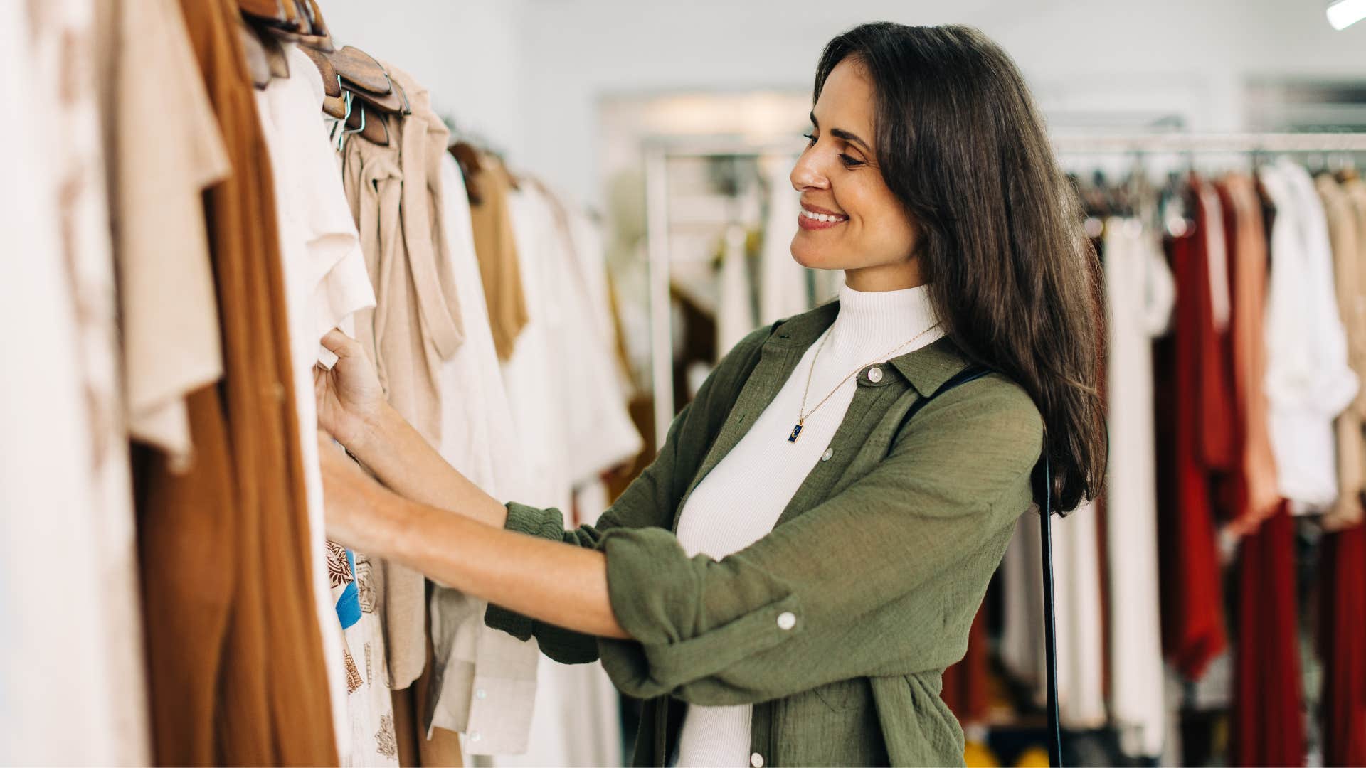 woman shopping fast fashion smiling at store