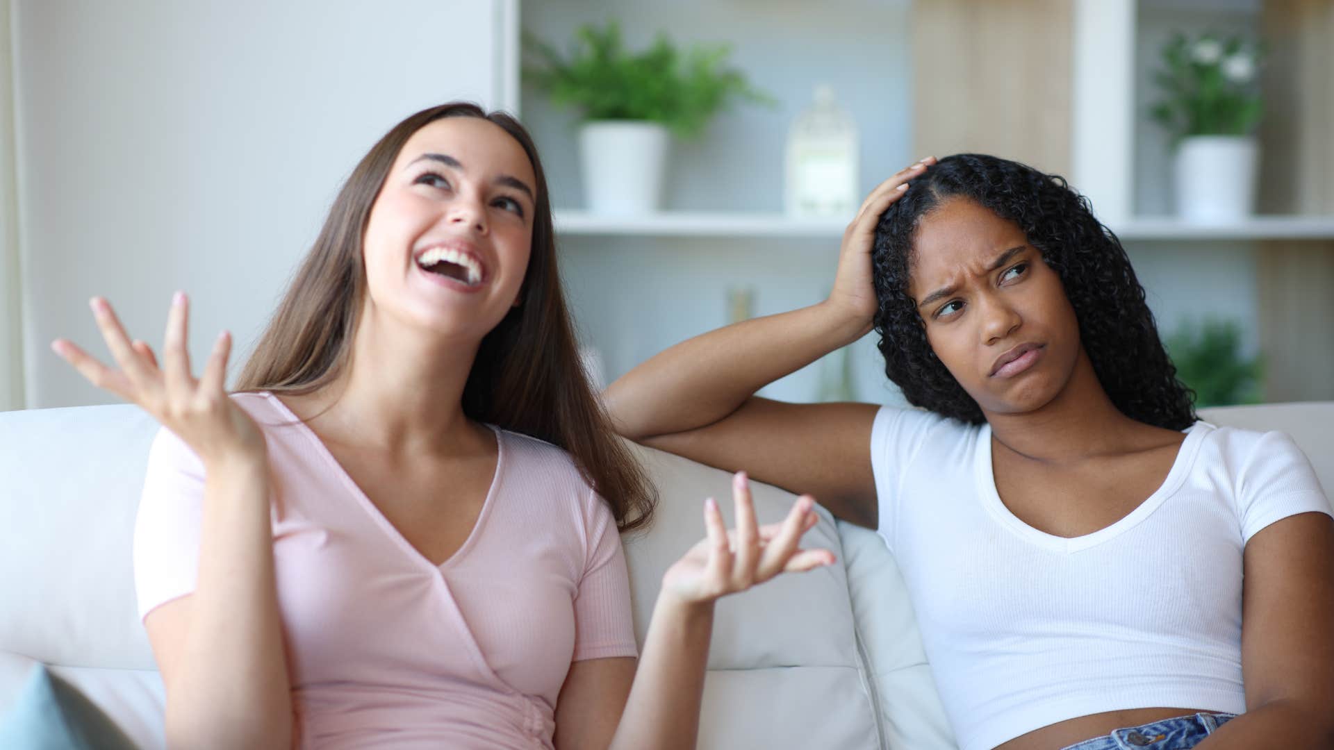 woman annoyed by friend cutting her off mid-thought