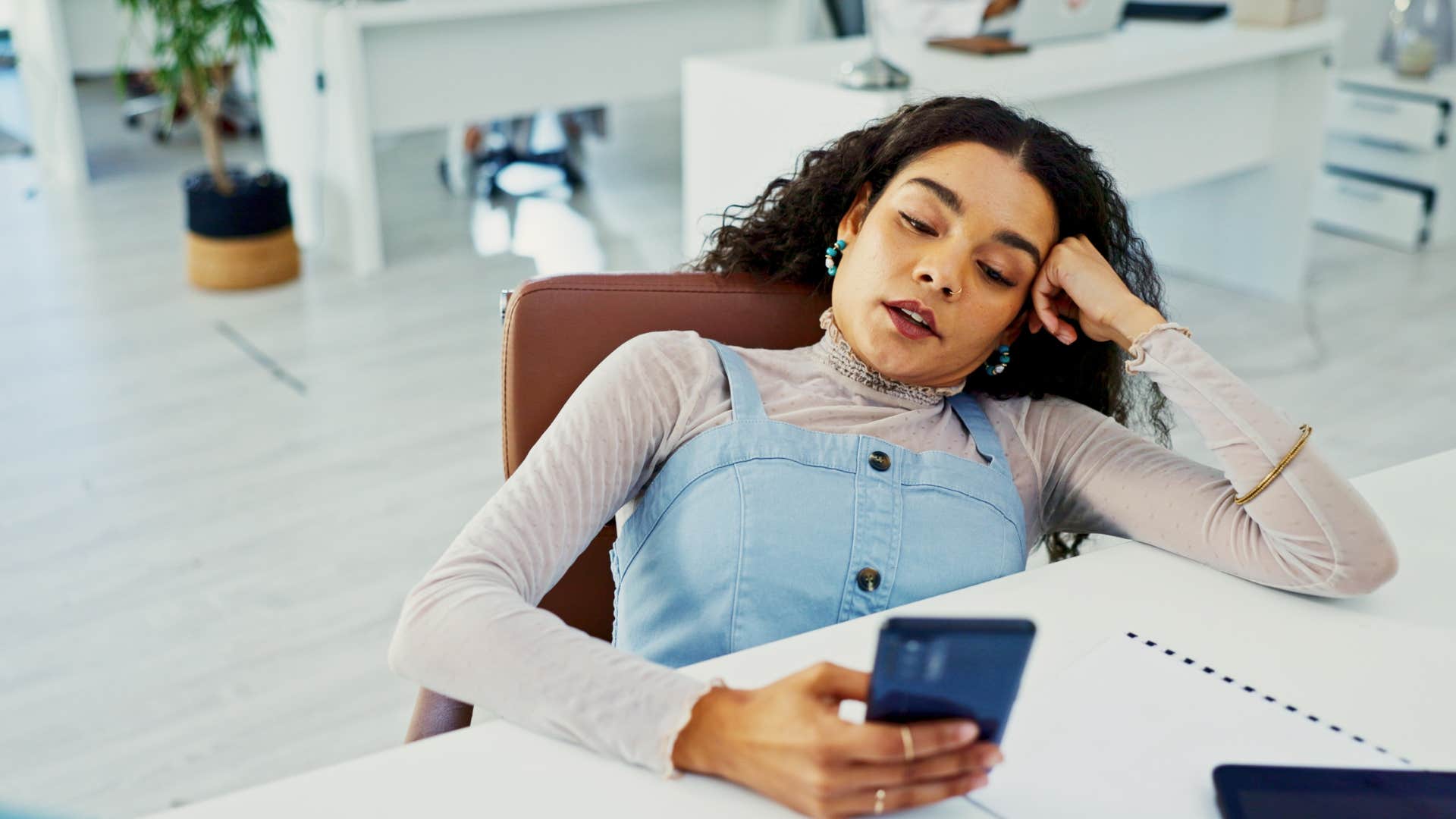 intelligent woman irritated by disorganization and chaos in workplace
