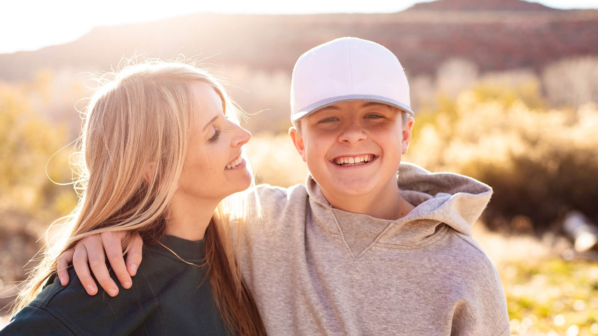 happy parent and child in nature showing les is more