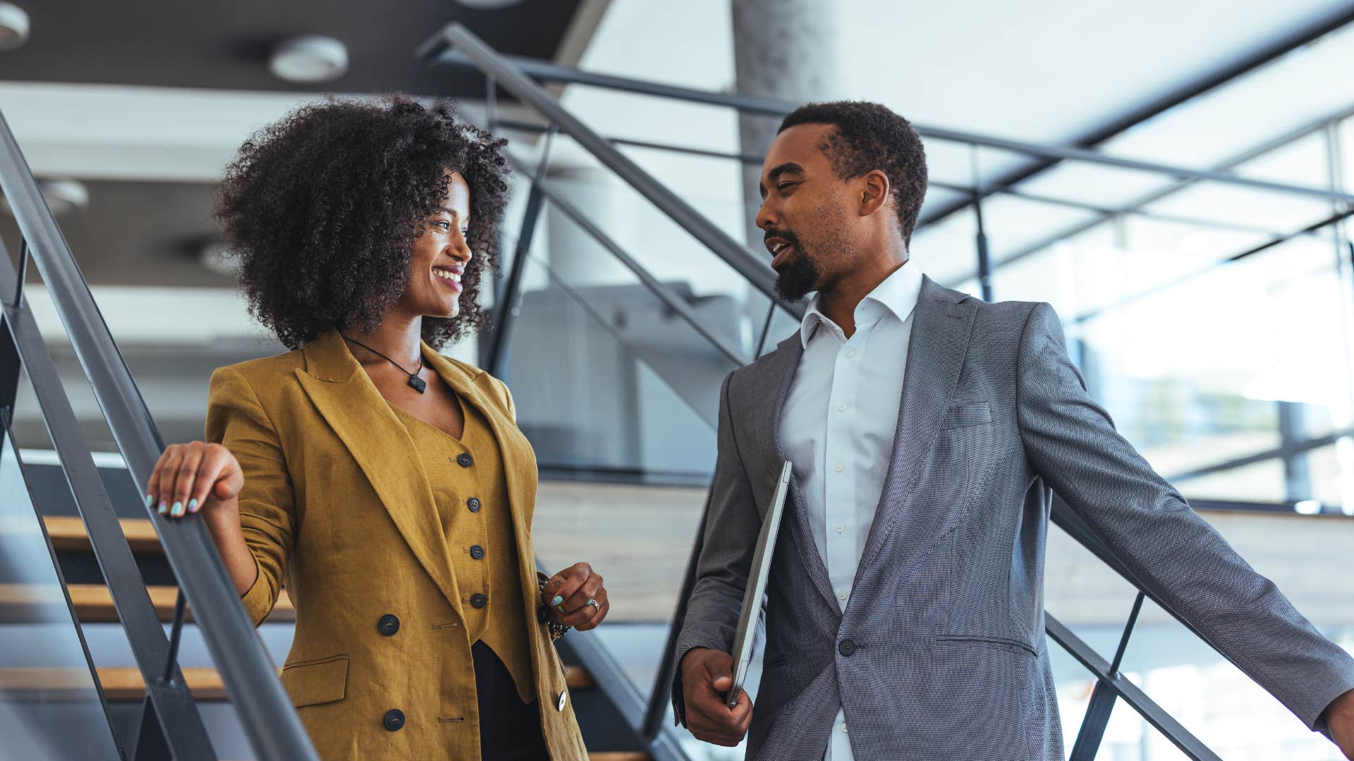professional woman talking to colleague not needing to prove her worth