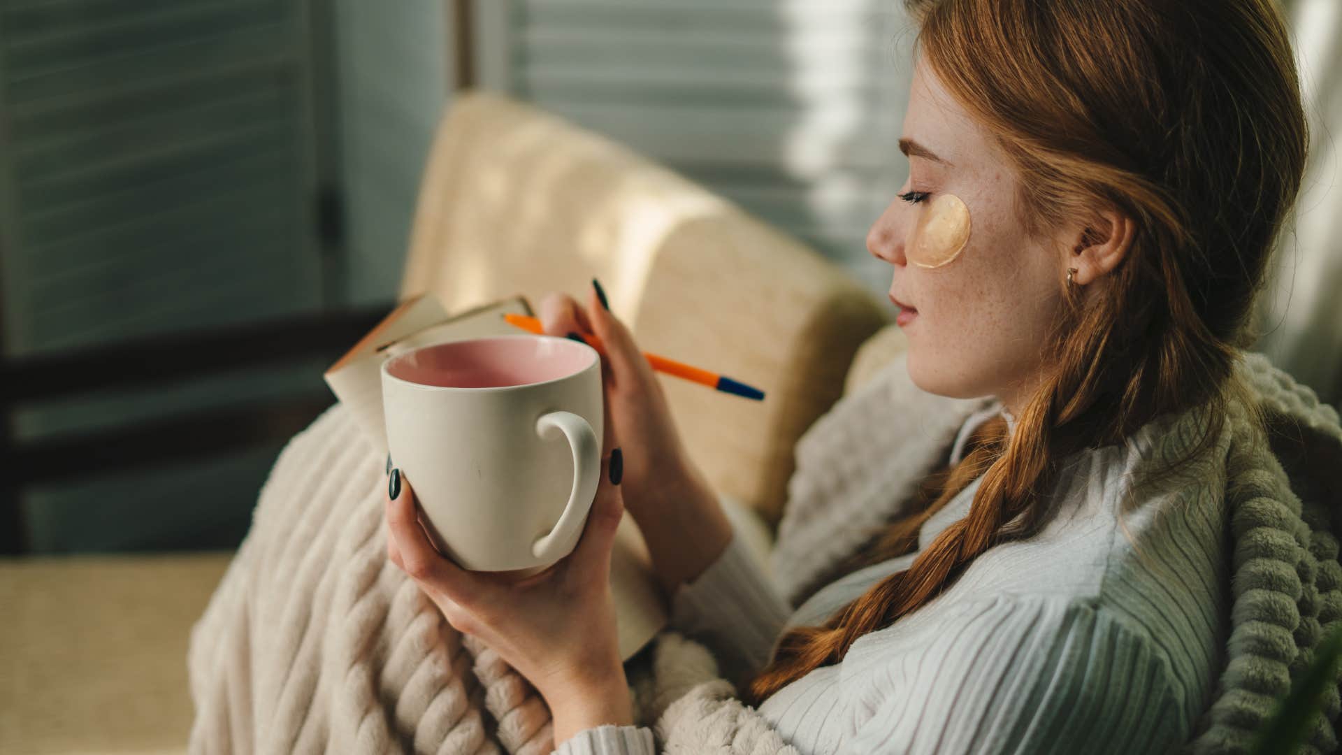 woman invested in herself journaling at home
