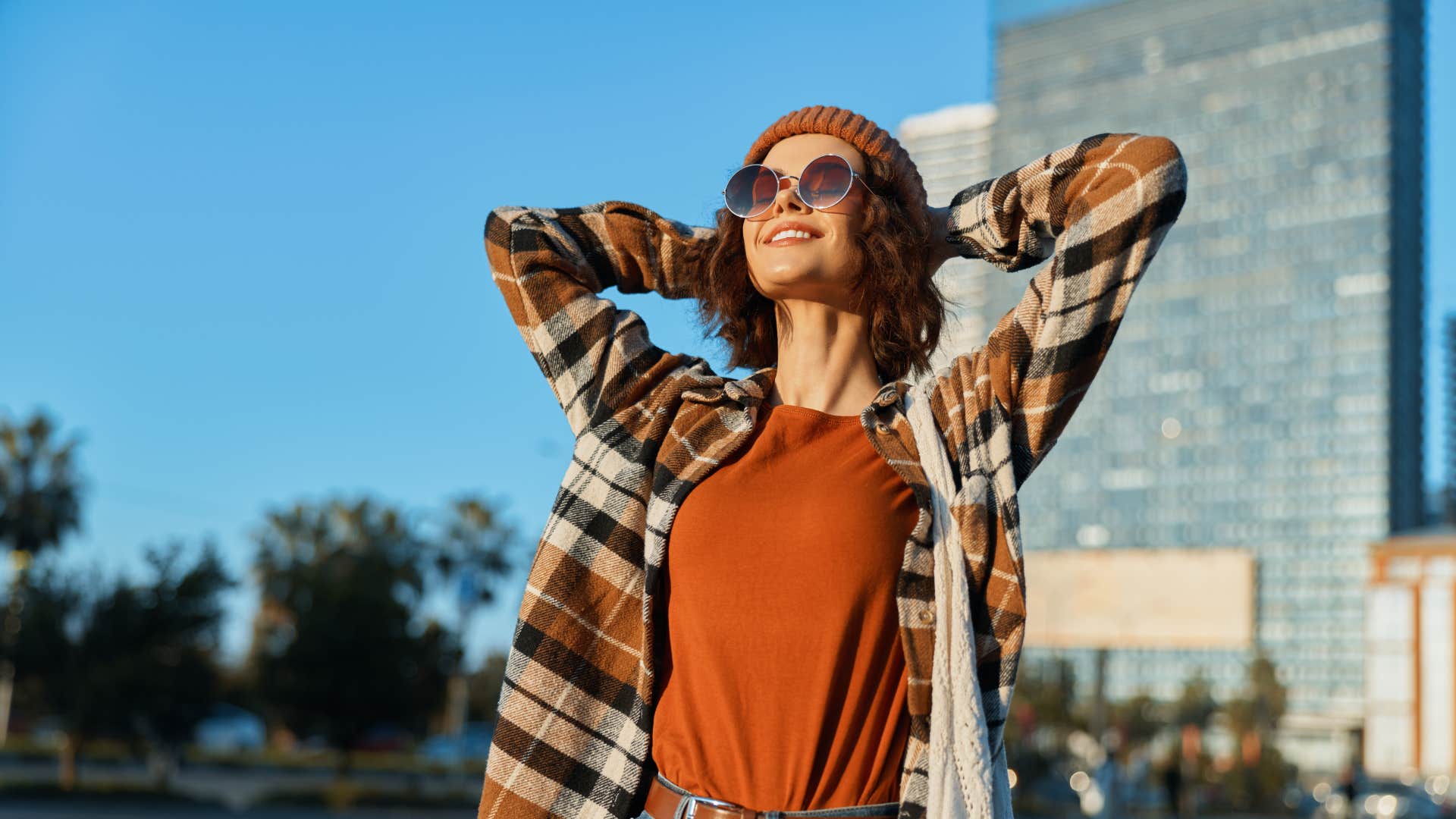 free-spirited woman standing outside not chasing anyone