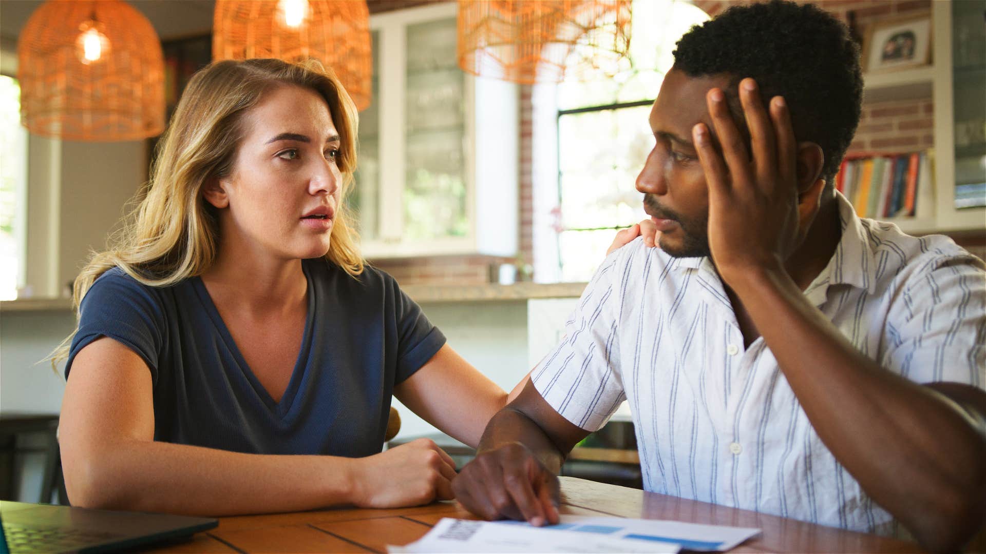 couple having close conversation woman saying you don't owe me anything
