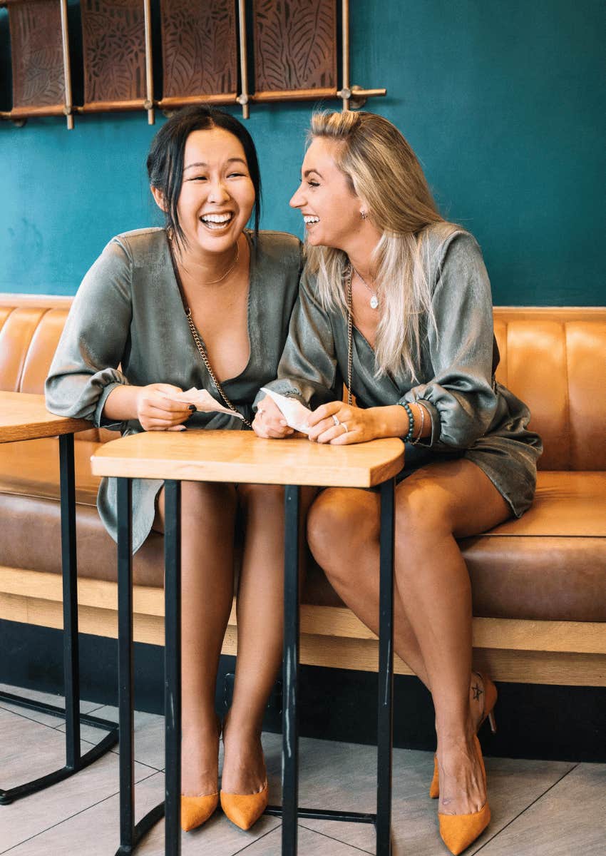 two female friends laughing together
