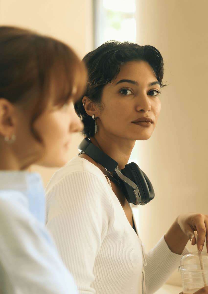 two serious women with tense body language