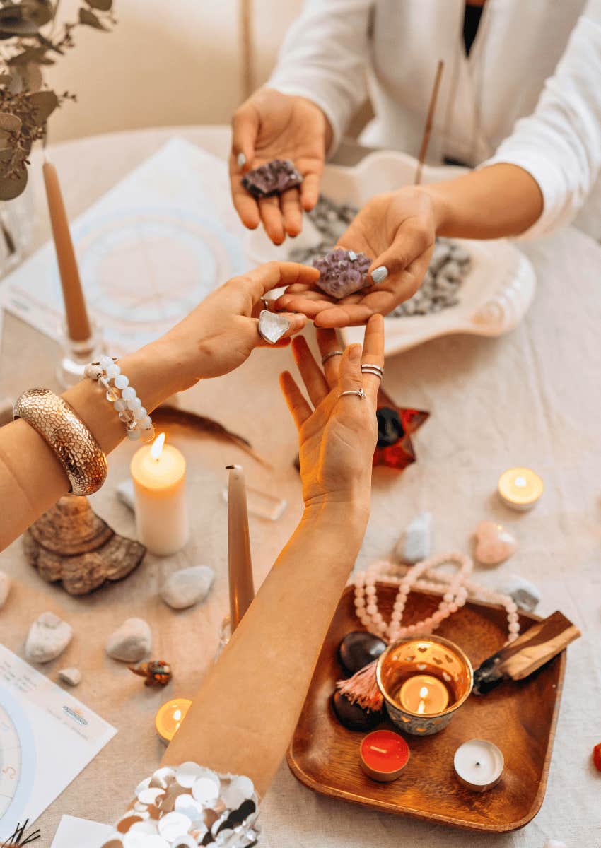 two women handling crystals