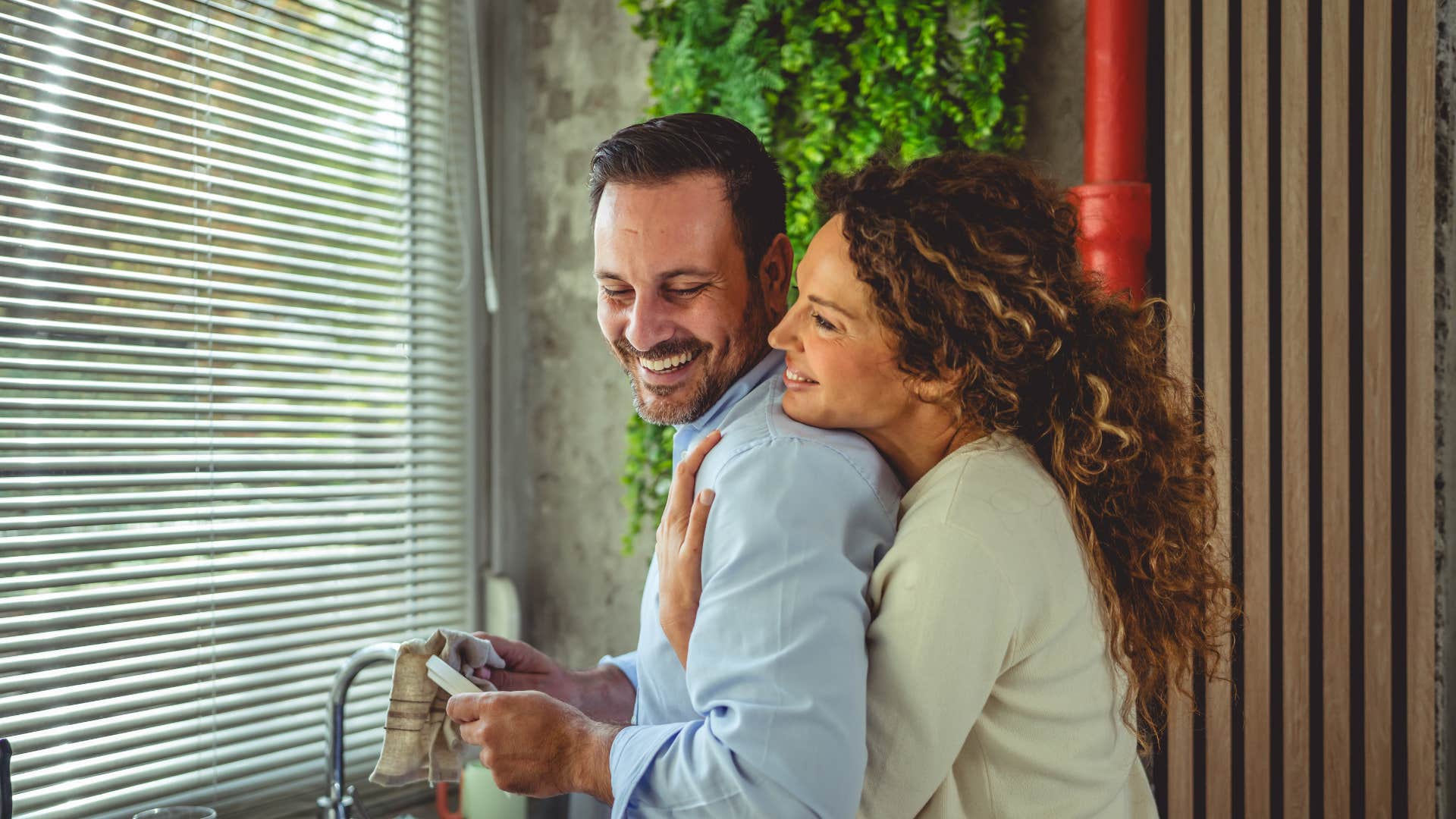 couple being loving together as they do chores since Time speeds up in a way you never expected
