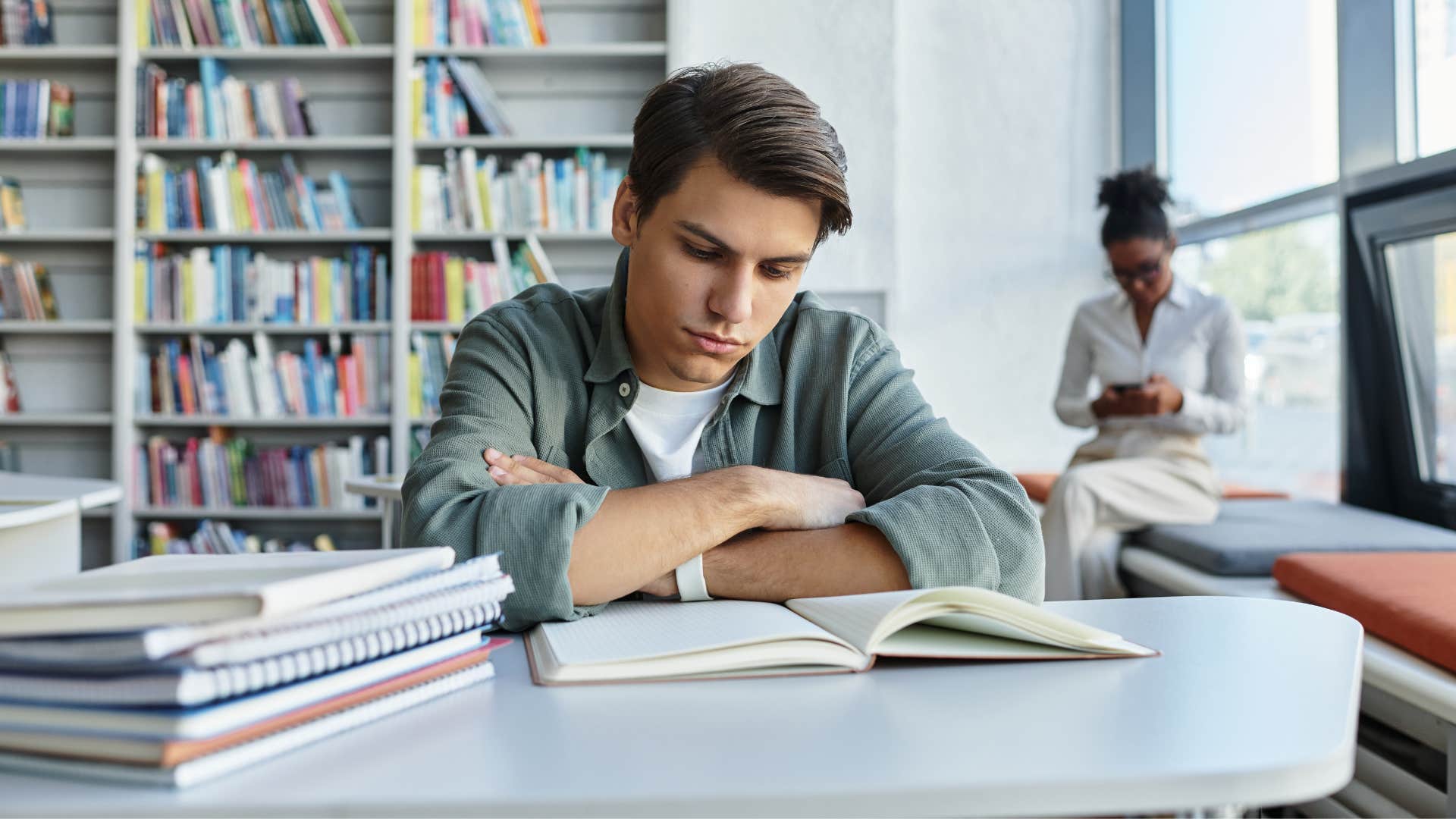 man in library studying as you become the average of your environment