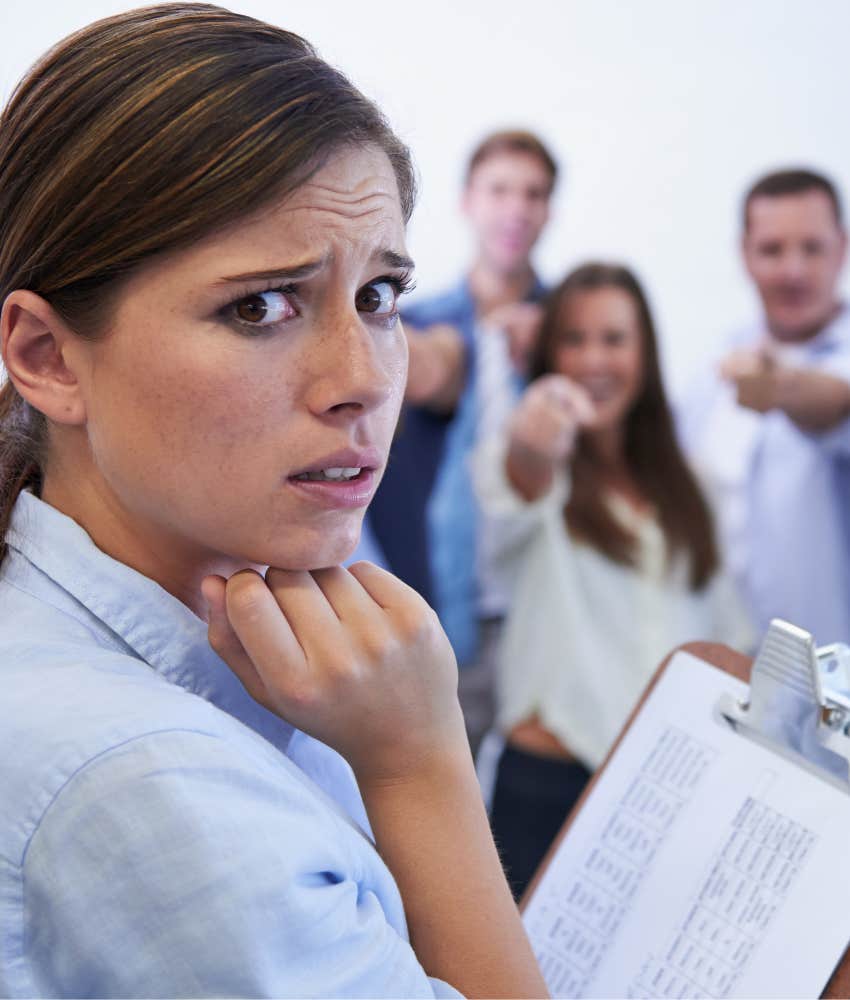 uncomfortable worker with colleagues pointed a them showing poor managment