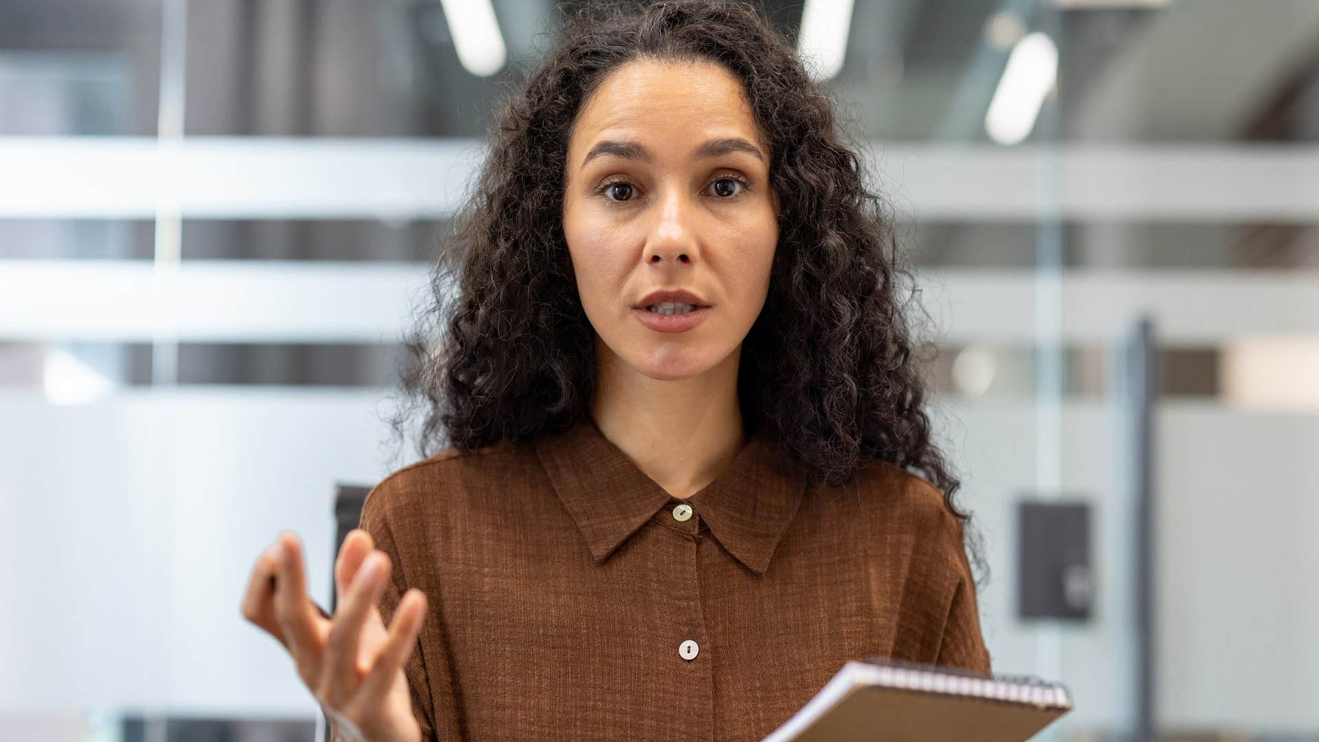 Woman being made the example of what not to do at work.