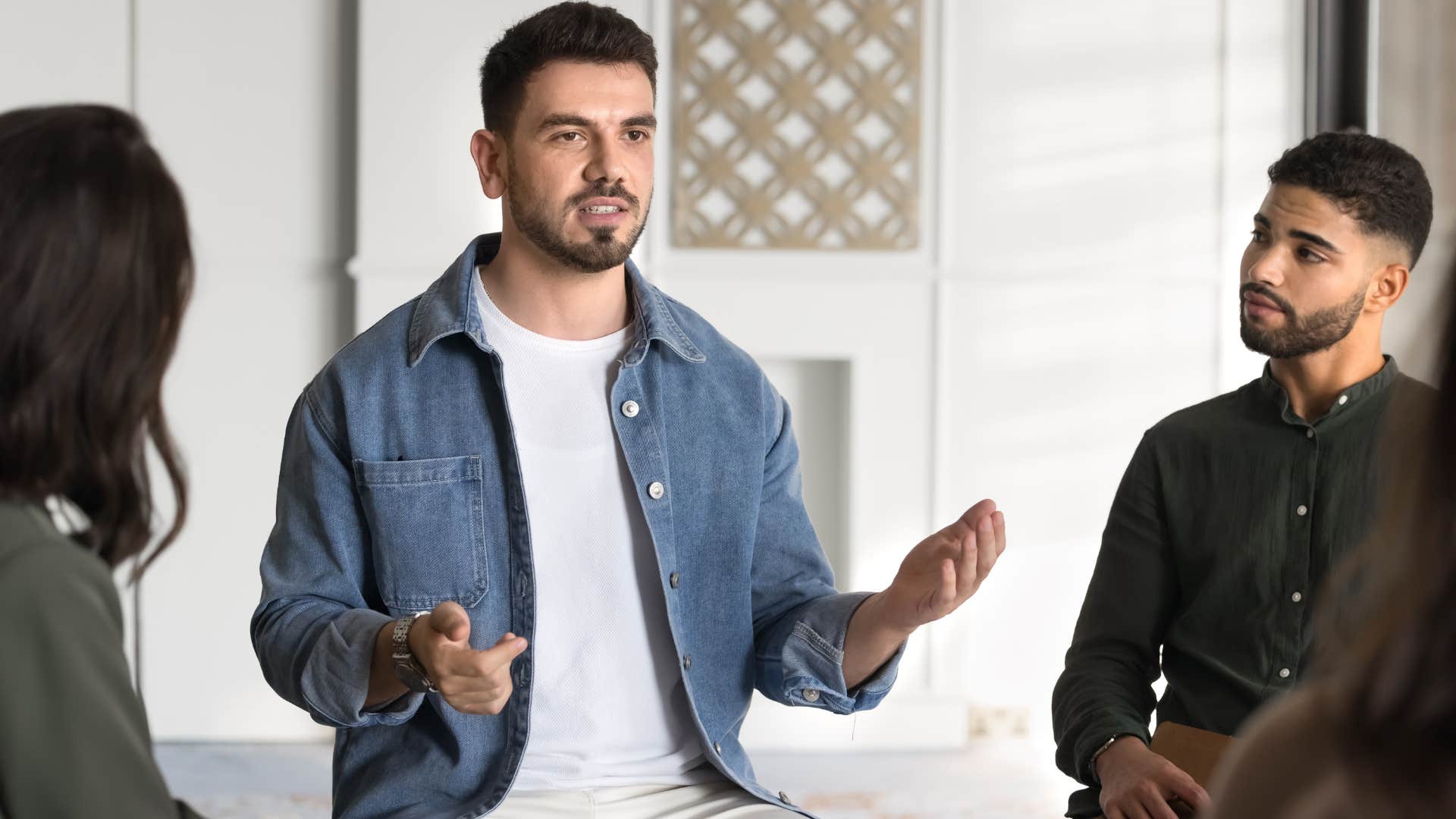 Man doing forced team building rituals at home.