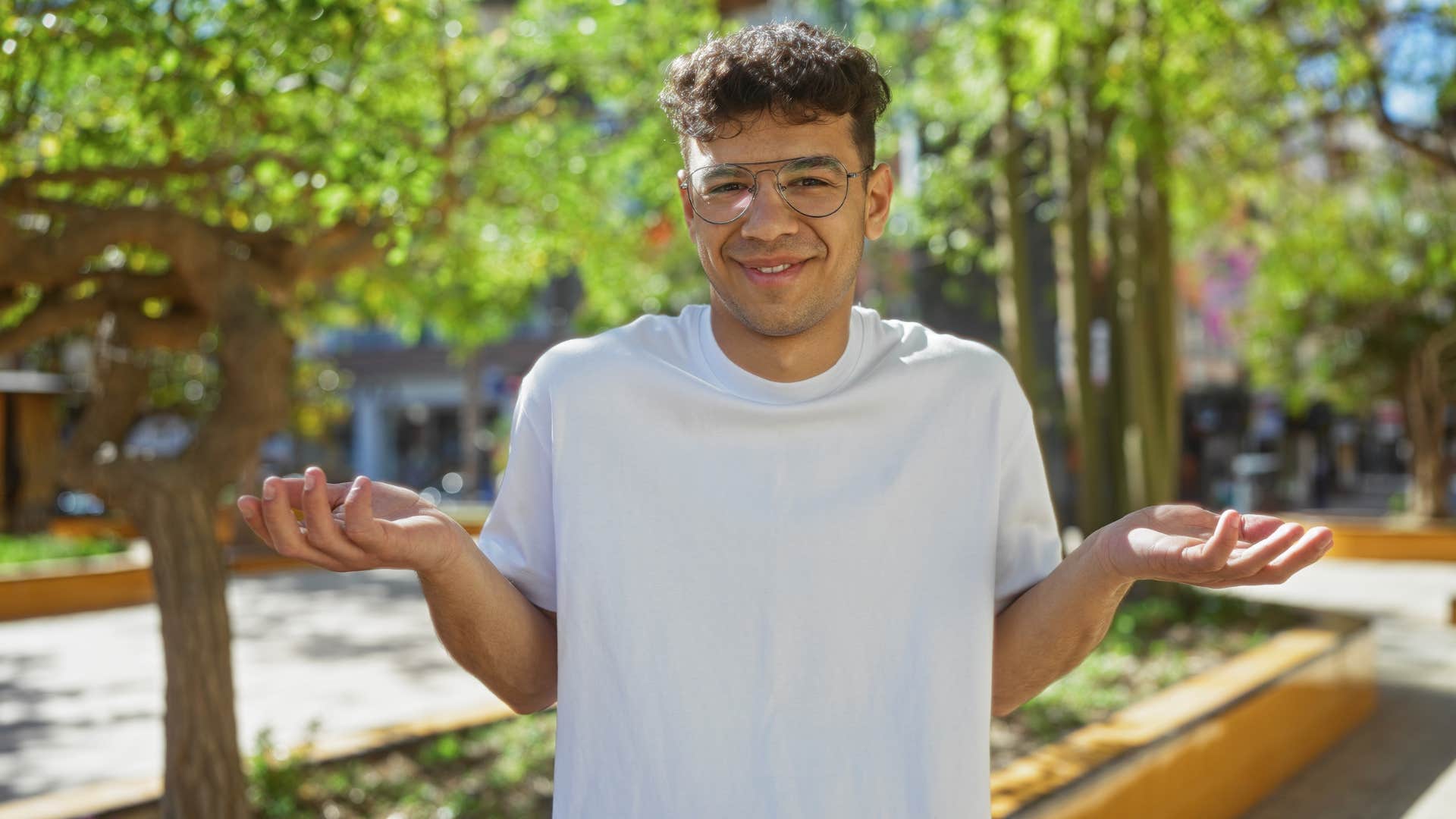 man in white shirt shrugging as he says it's obvious
