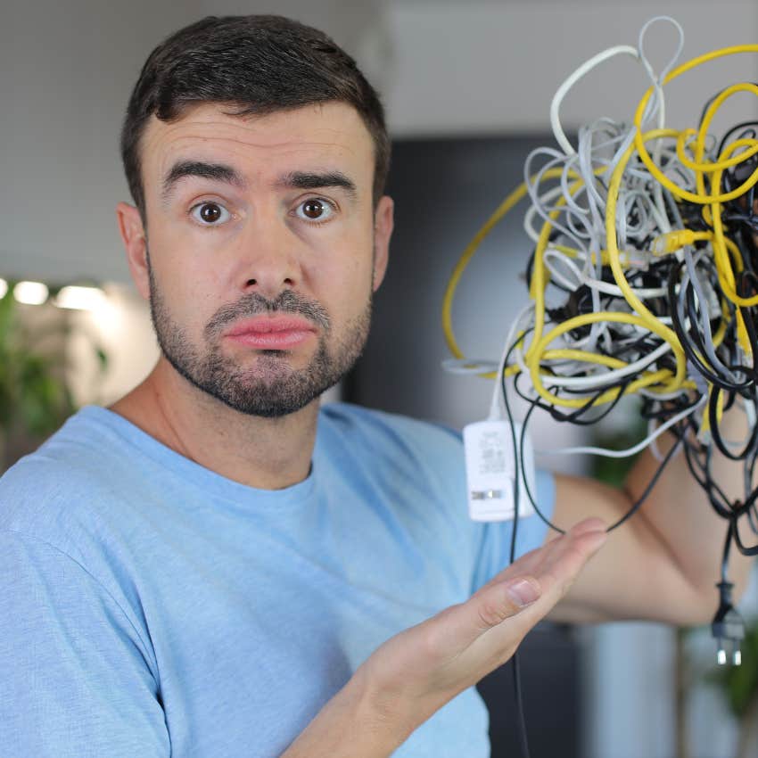 man holding tangled cords cables clutter reveals overthinking
