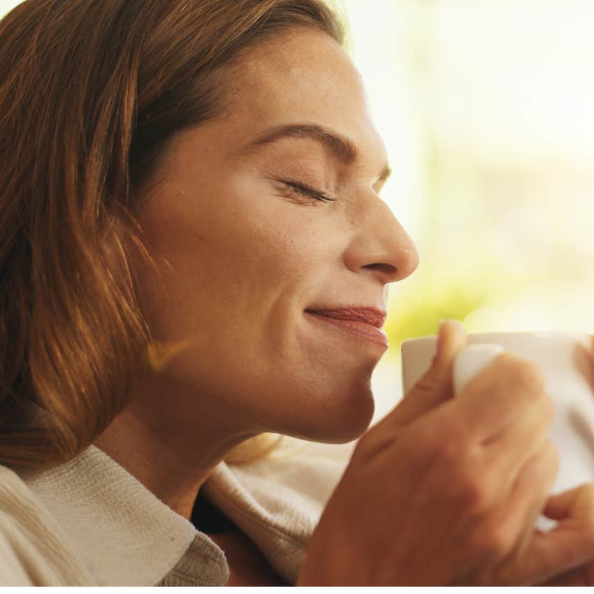 Woman who always trusts herself drinking tea at home