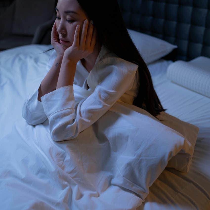 woman waking up in the middle of the night so she can sleep in shifts
