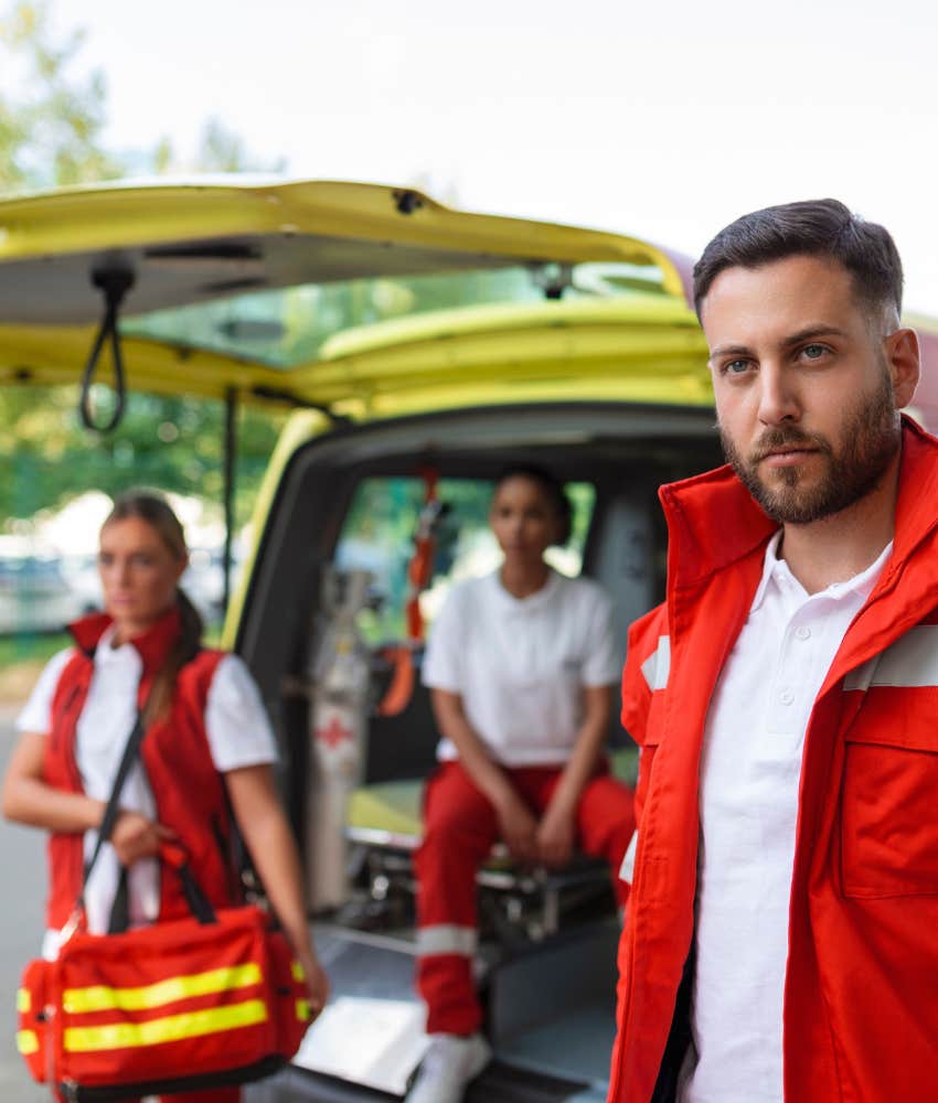 ambulance crew arrives at emergency showing heart attack