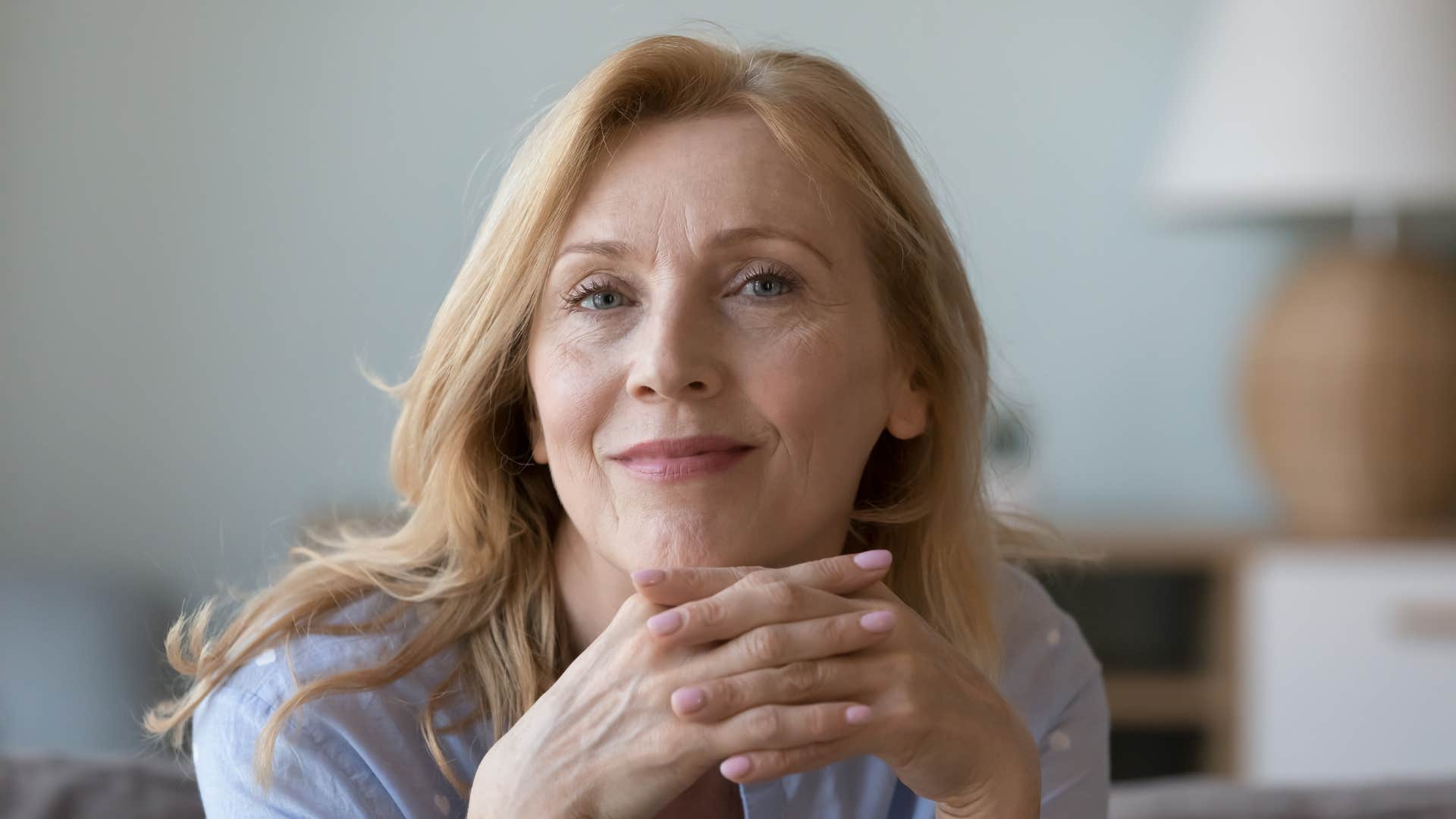 woman existing in quiet confidence smiling