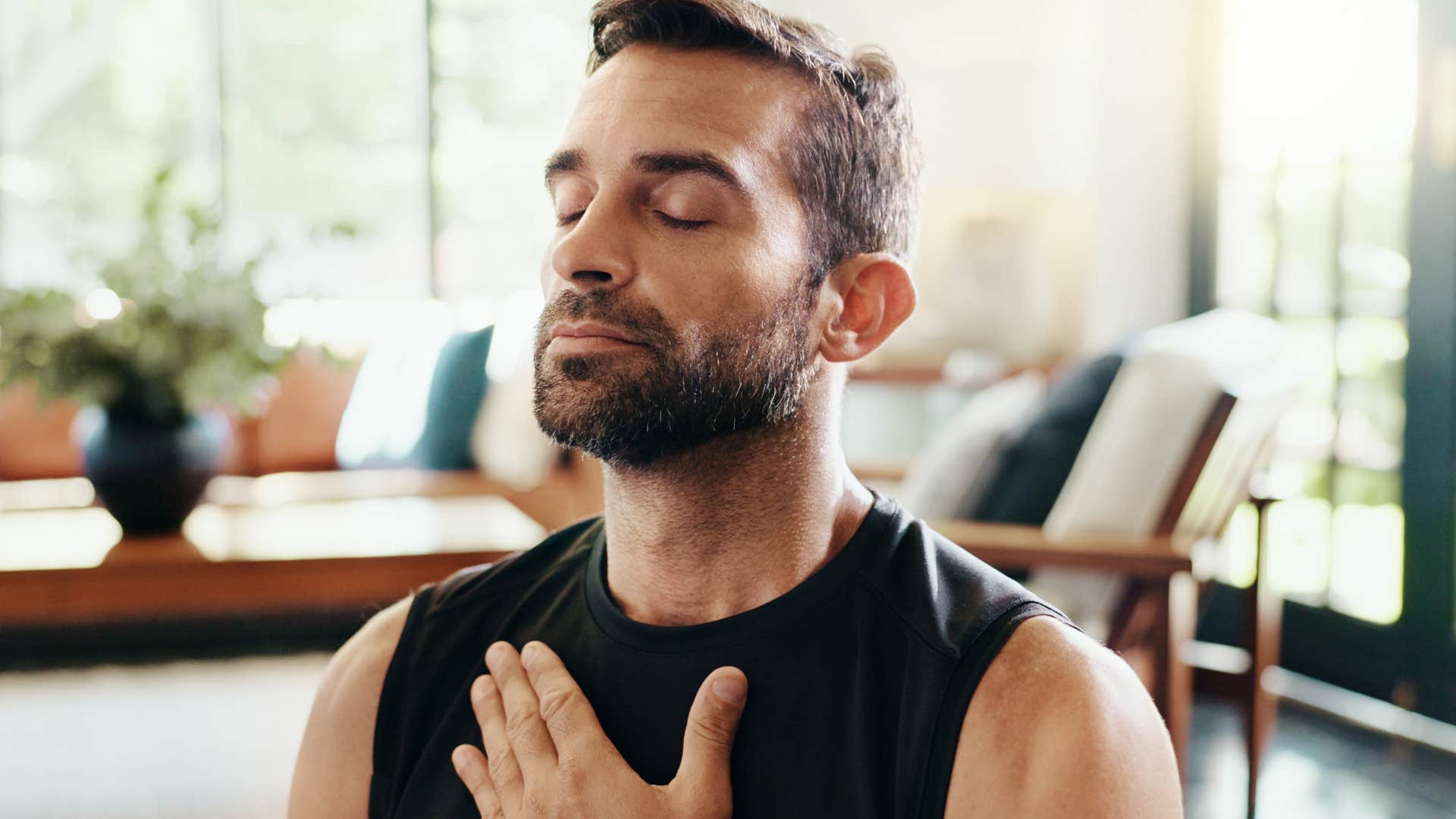 man with a strong aura meditating peacefully