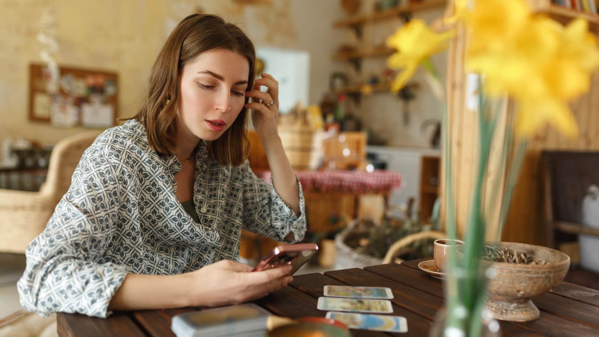 woman tapping into her psychic abilities with tarot spread