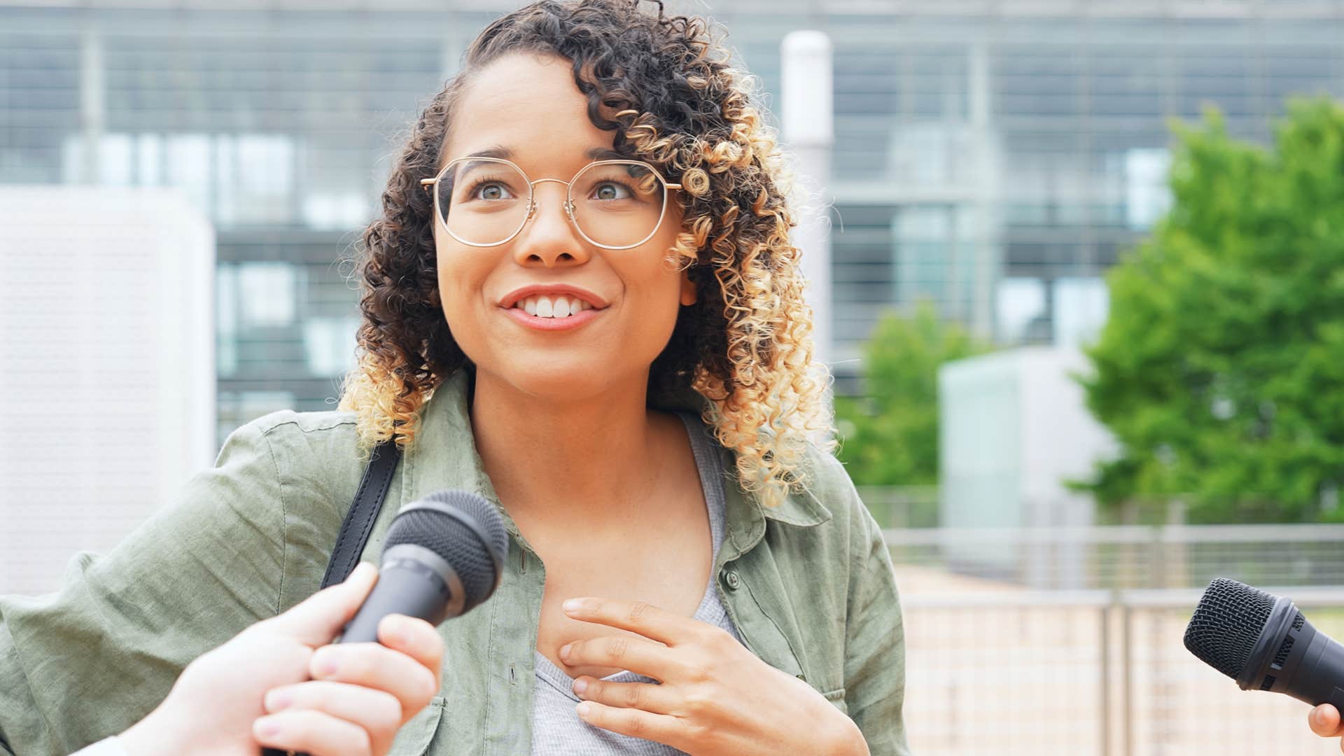woman who flocks to high-status people and environments doing an interview