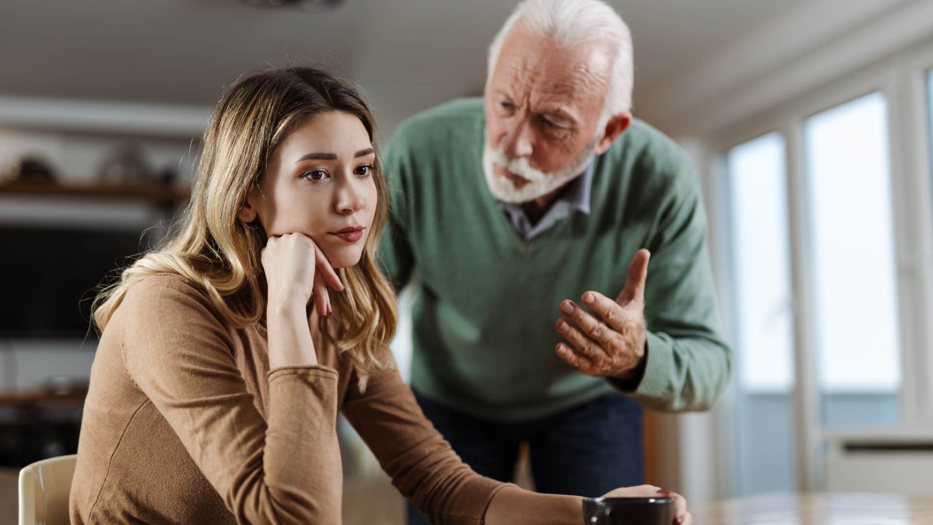 older father dismissing his adult daughter's feelings