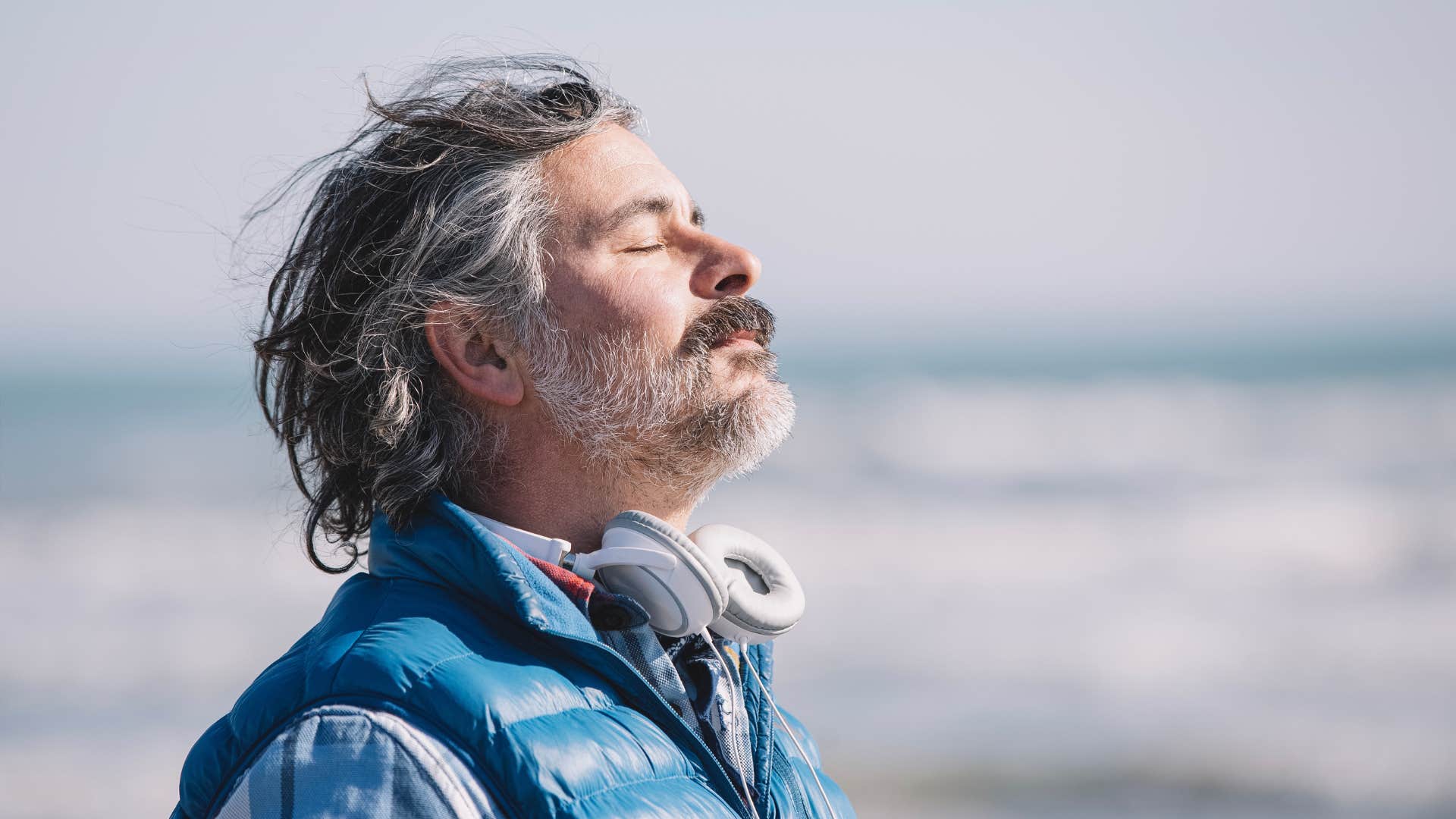 Man with no friends standing outside getting fresh air