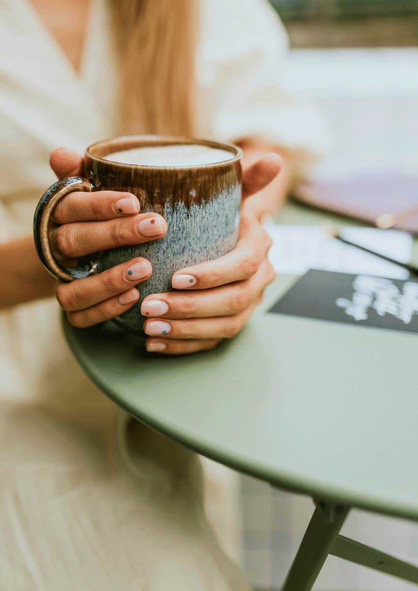 woman holding coffee mug appreciating every little good thing