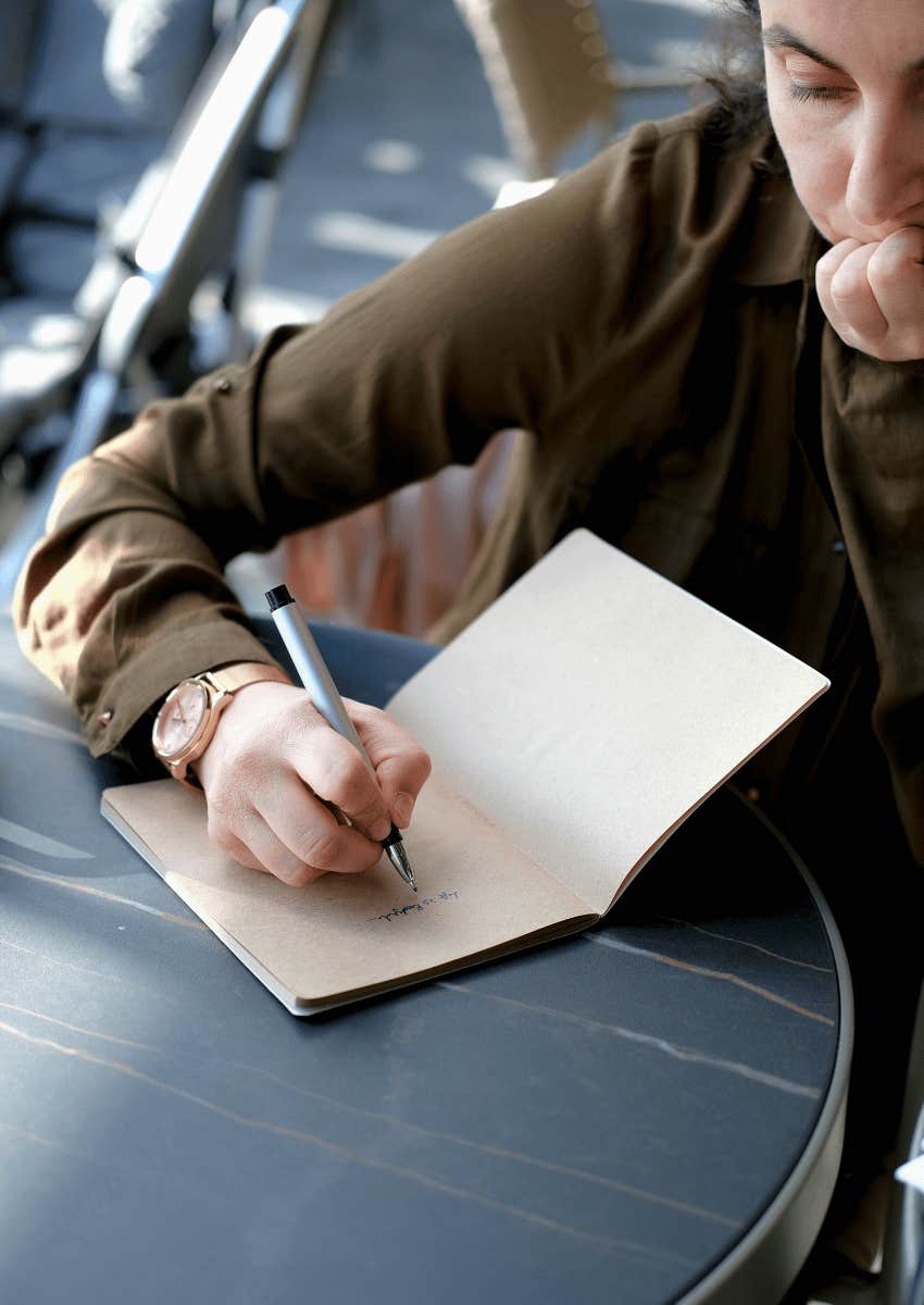 woman writing in journal