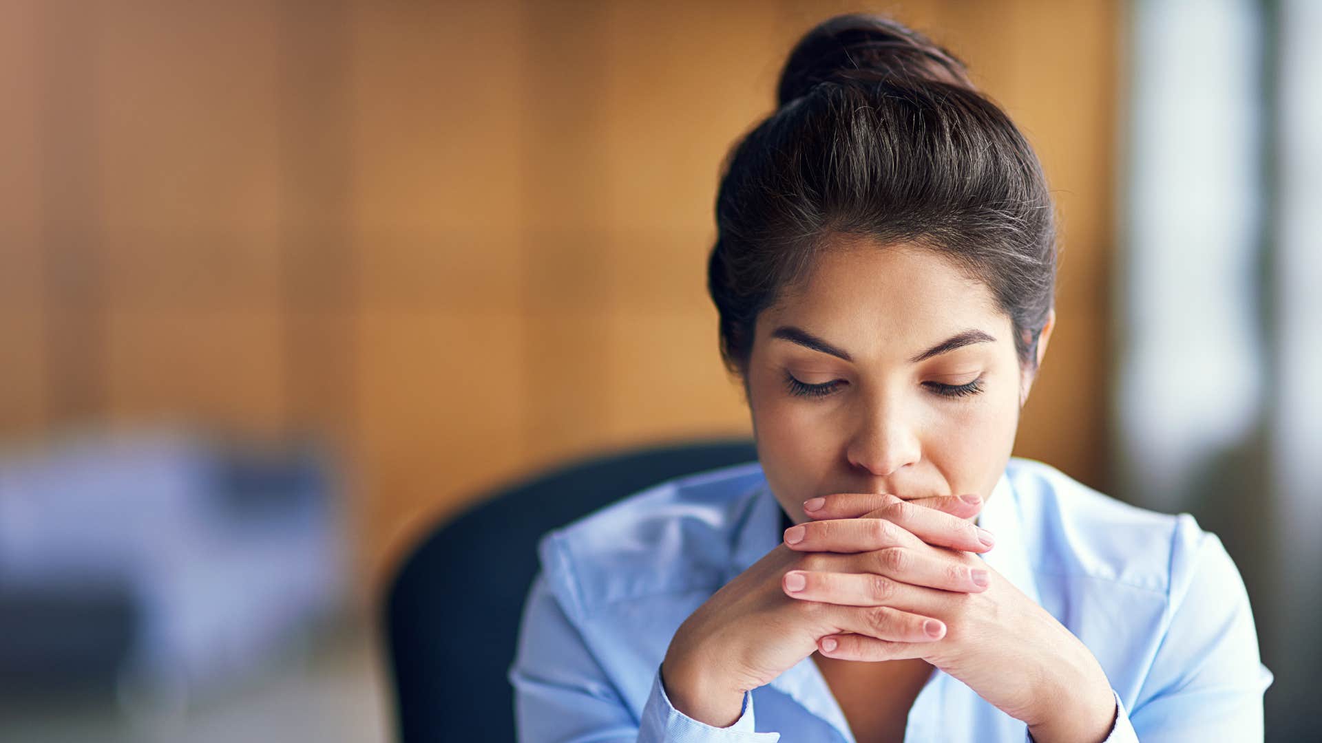 sad professional woman telling herself i'm not that special