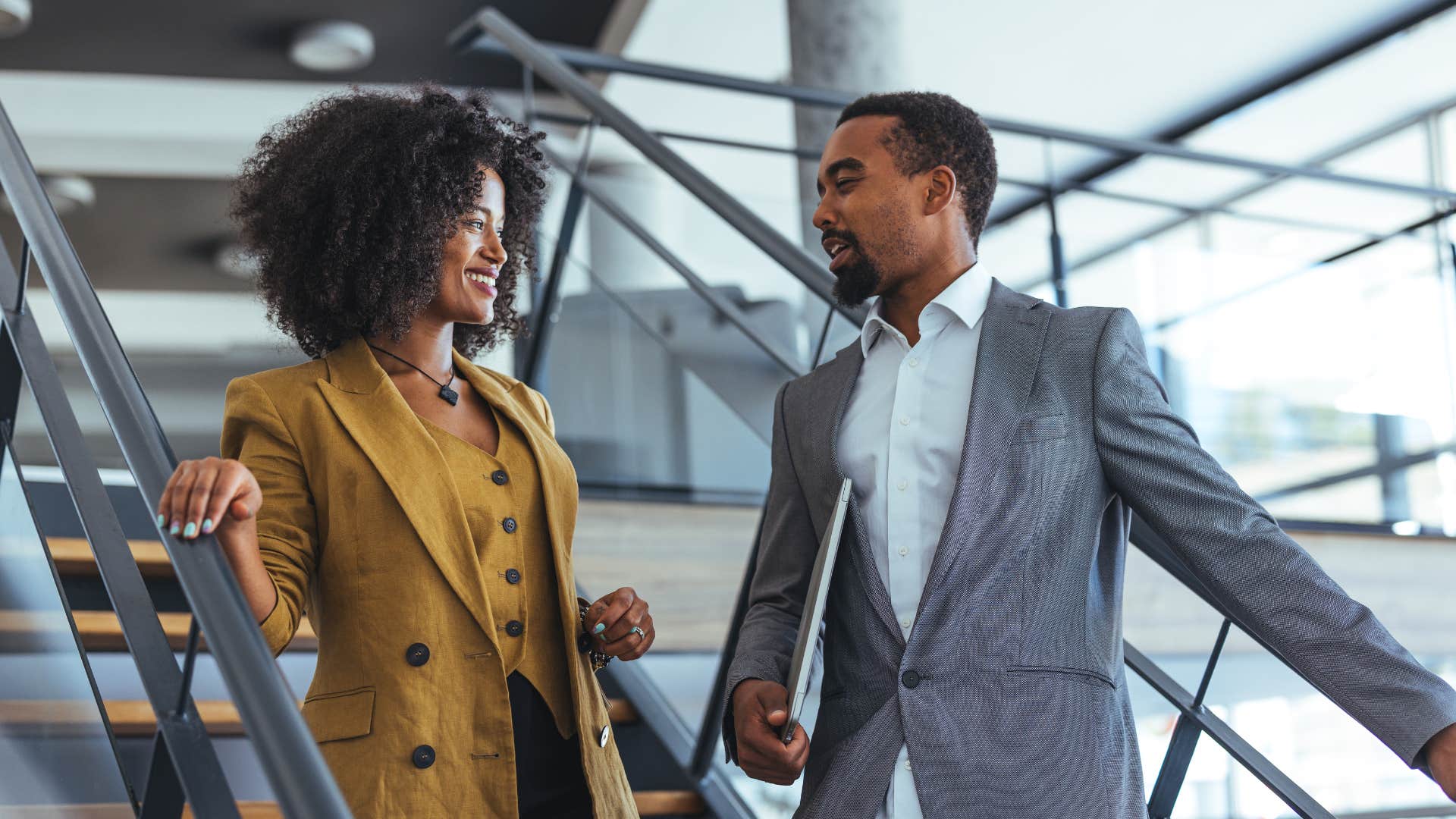 woman chatting with colleague saying to him everyone feels like this