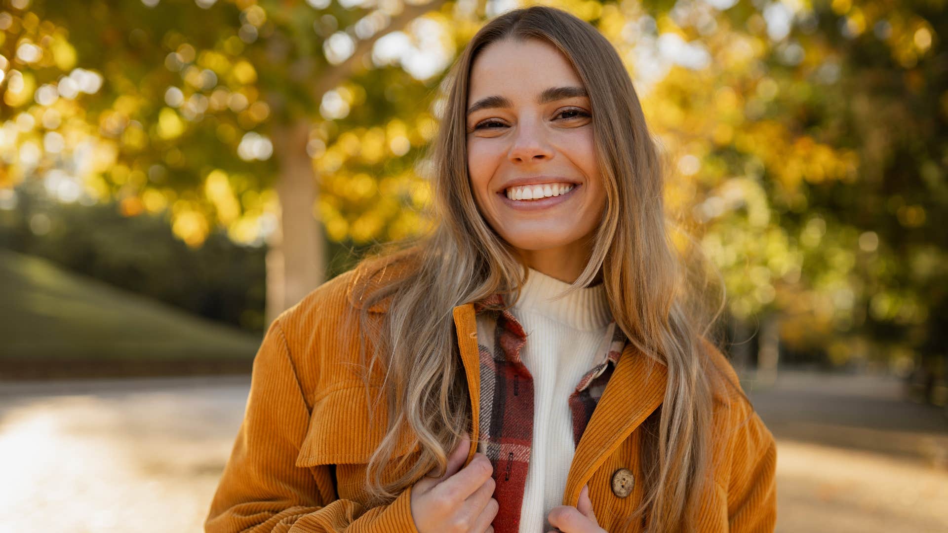 woman fake smiling pretending to be happy telling herself everything's perfect