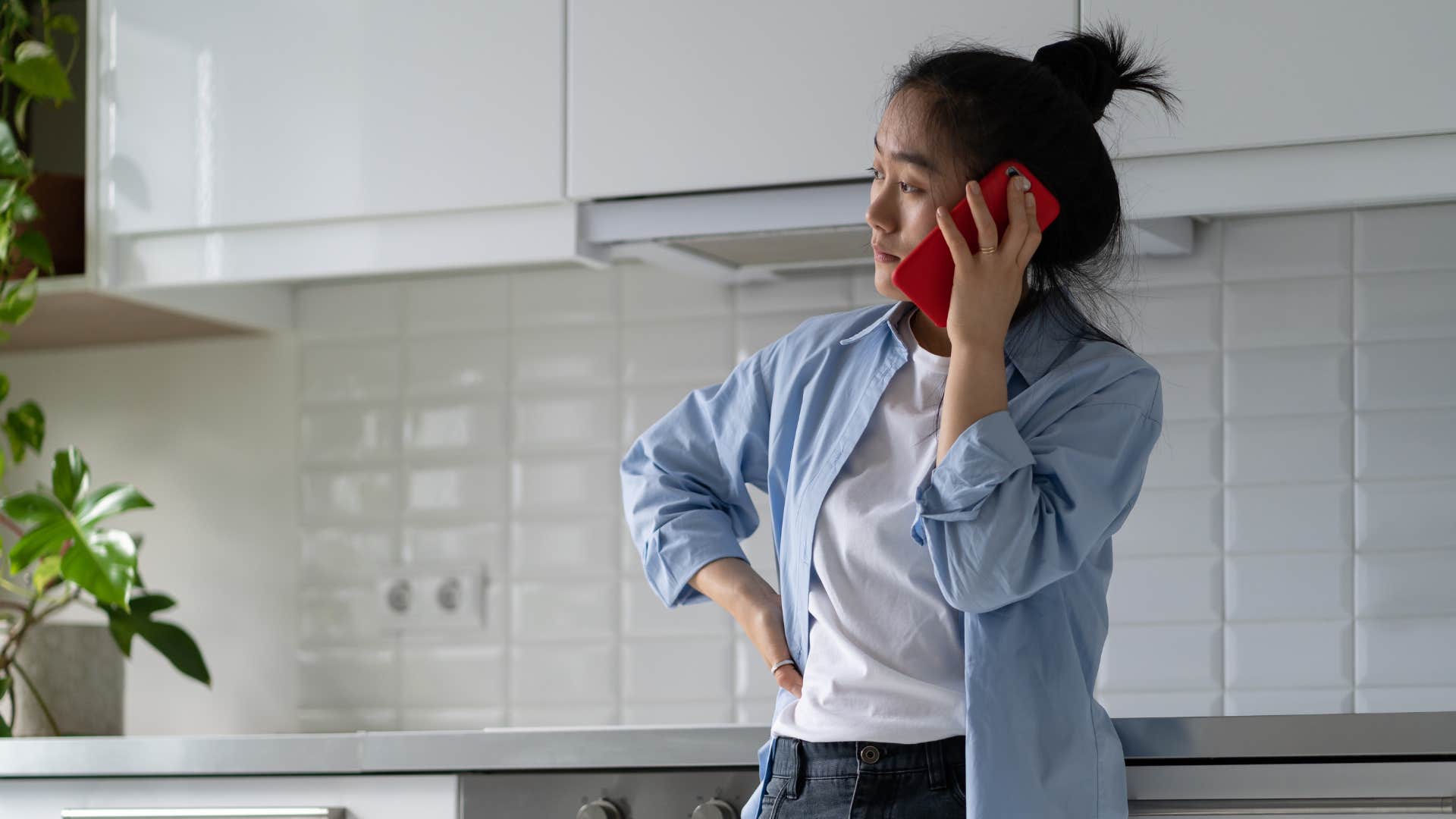 upset woman pretending to be happy on the phone saying it is what it is