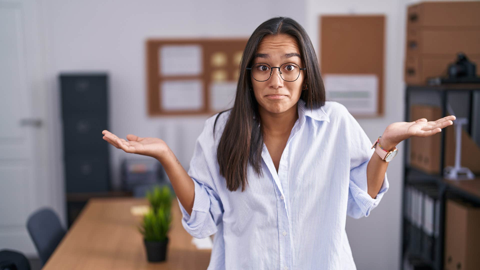woman shrugging telling herself other people have it worse