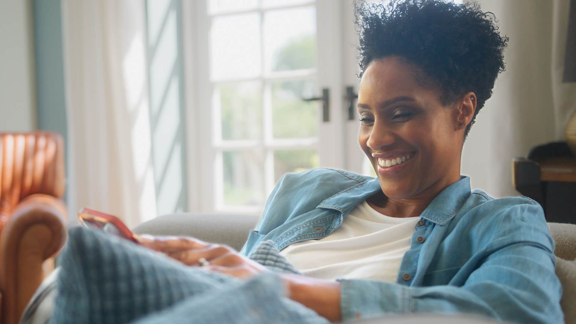 happy woman appreciating silence and quietness at home
