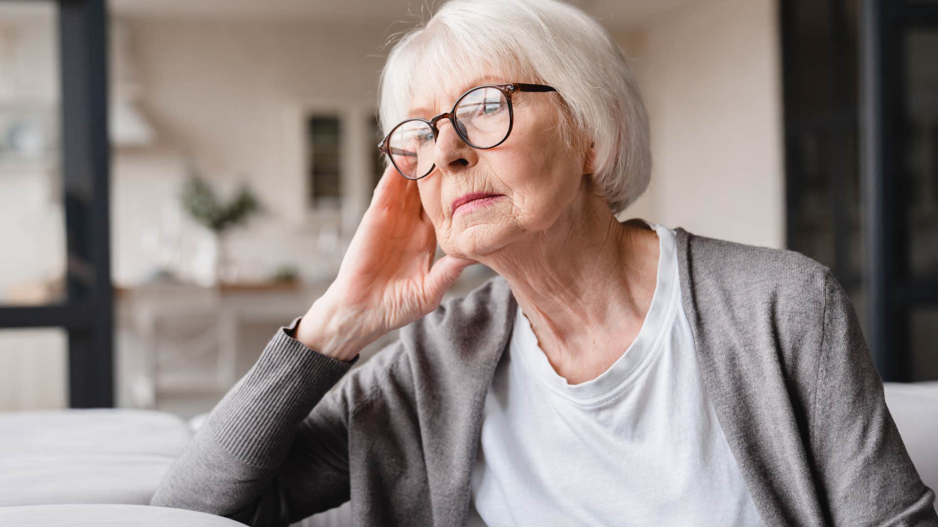 pensive older woman with an aching kind of gratitude