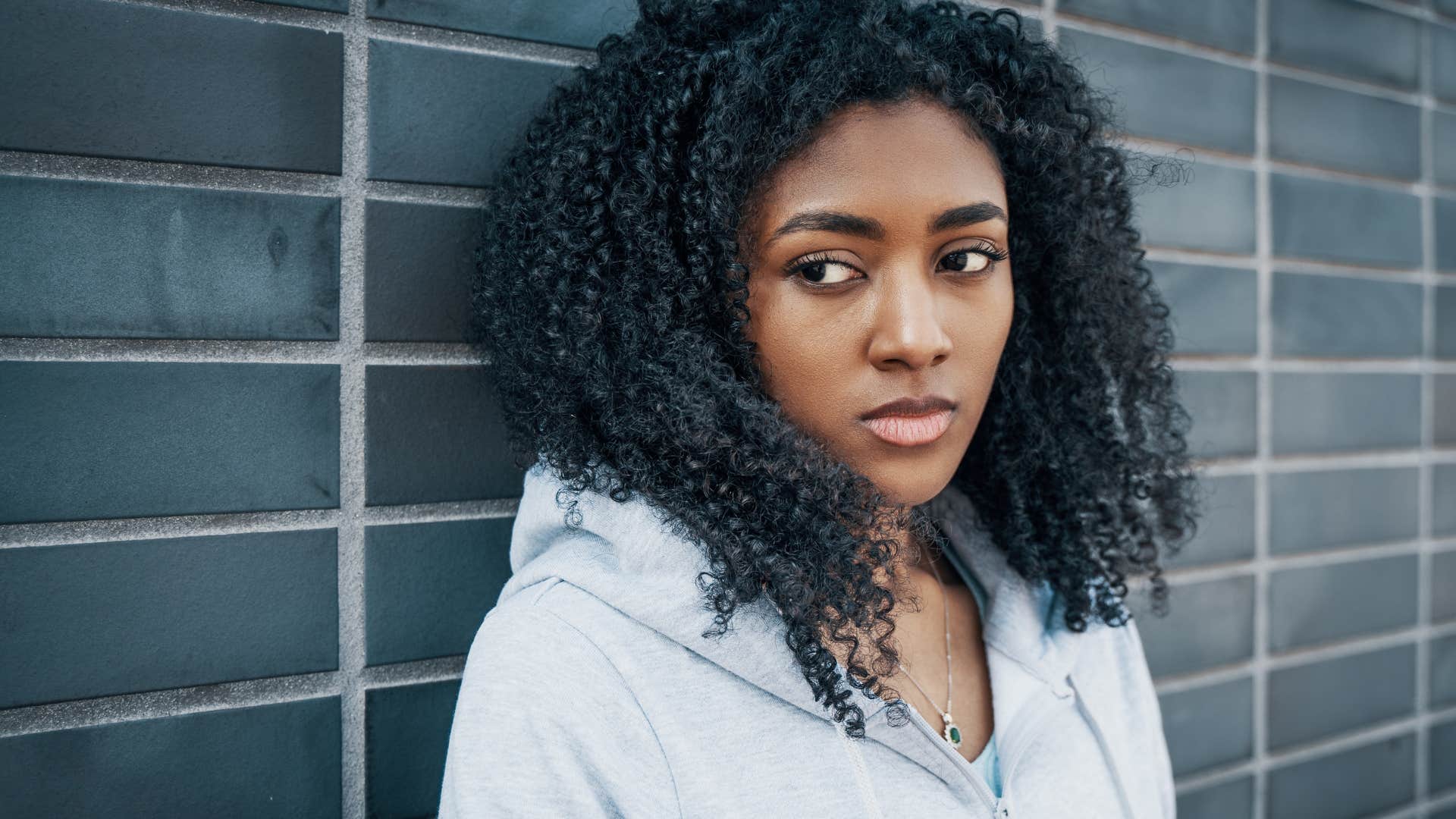 woman feeling anger and jealousy after losing her mother