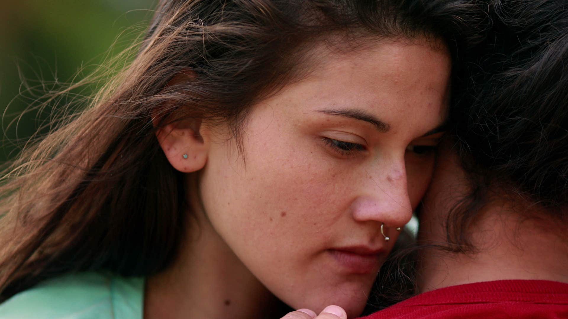 woman hugging someone with deep empathy for shared loss