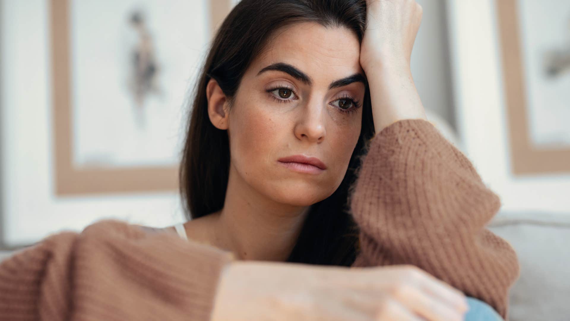 sad woman feeling numbness at home after losing her mother