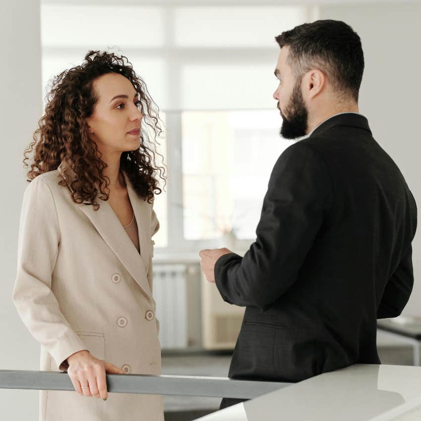 employees talking after meeting where worker called boss dense