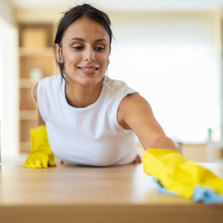 happy woman excited about cleaning and managing clutter at home
