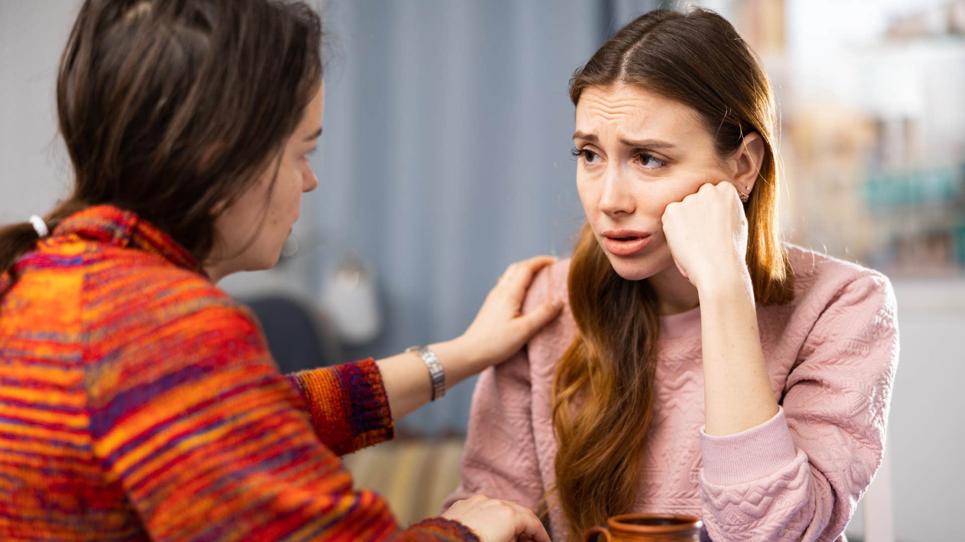 woman comforting friend saying i can tell that means a lot to you