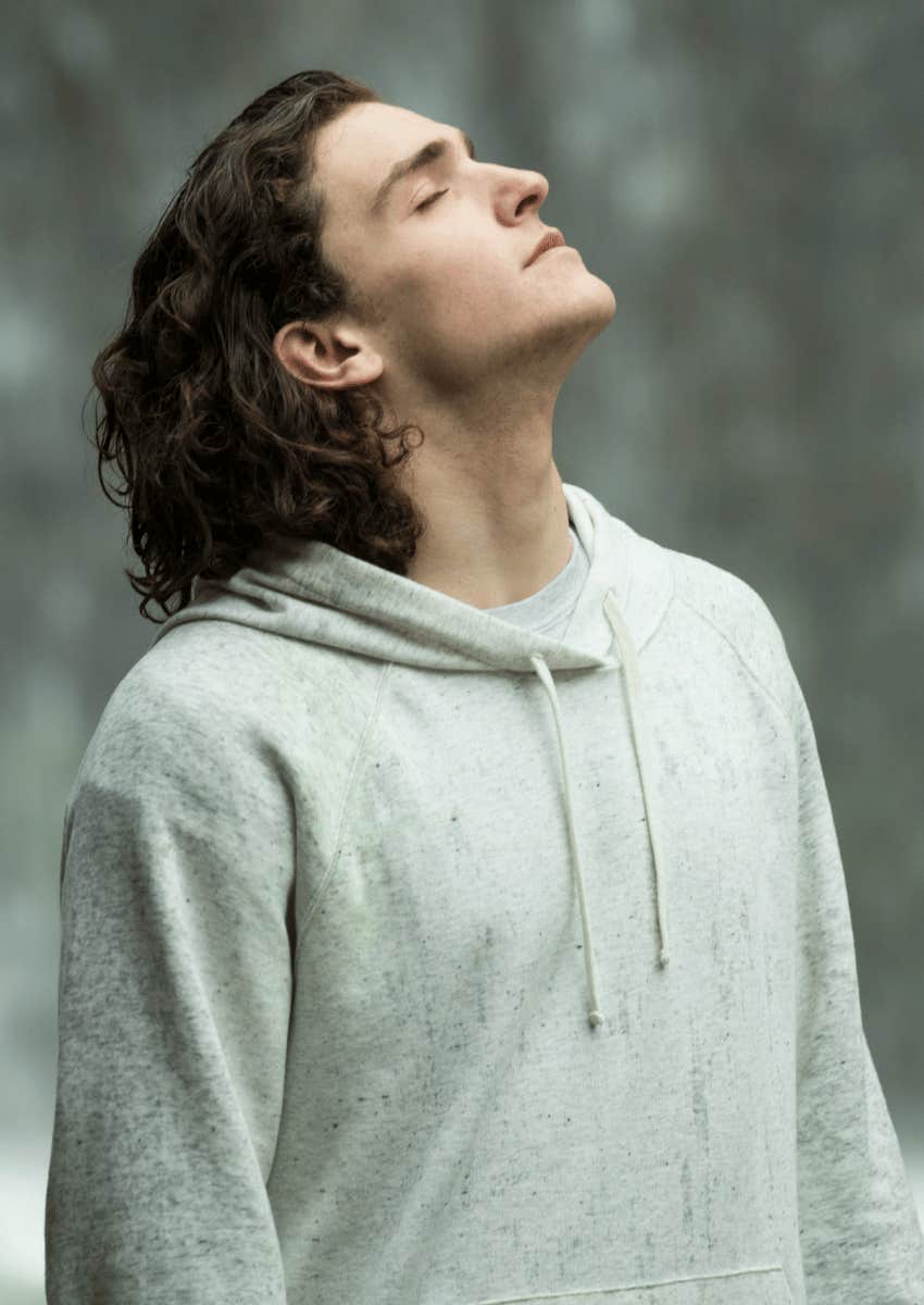 young man breathing deeply