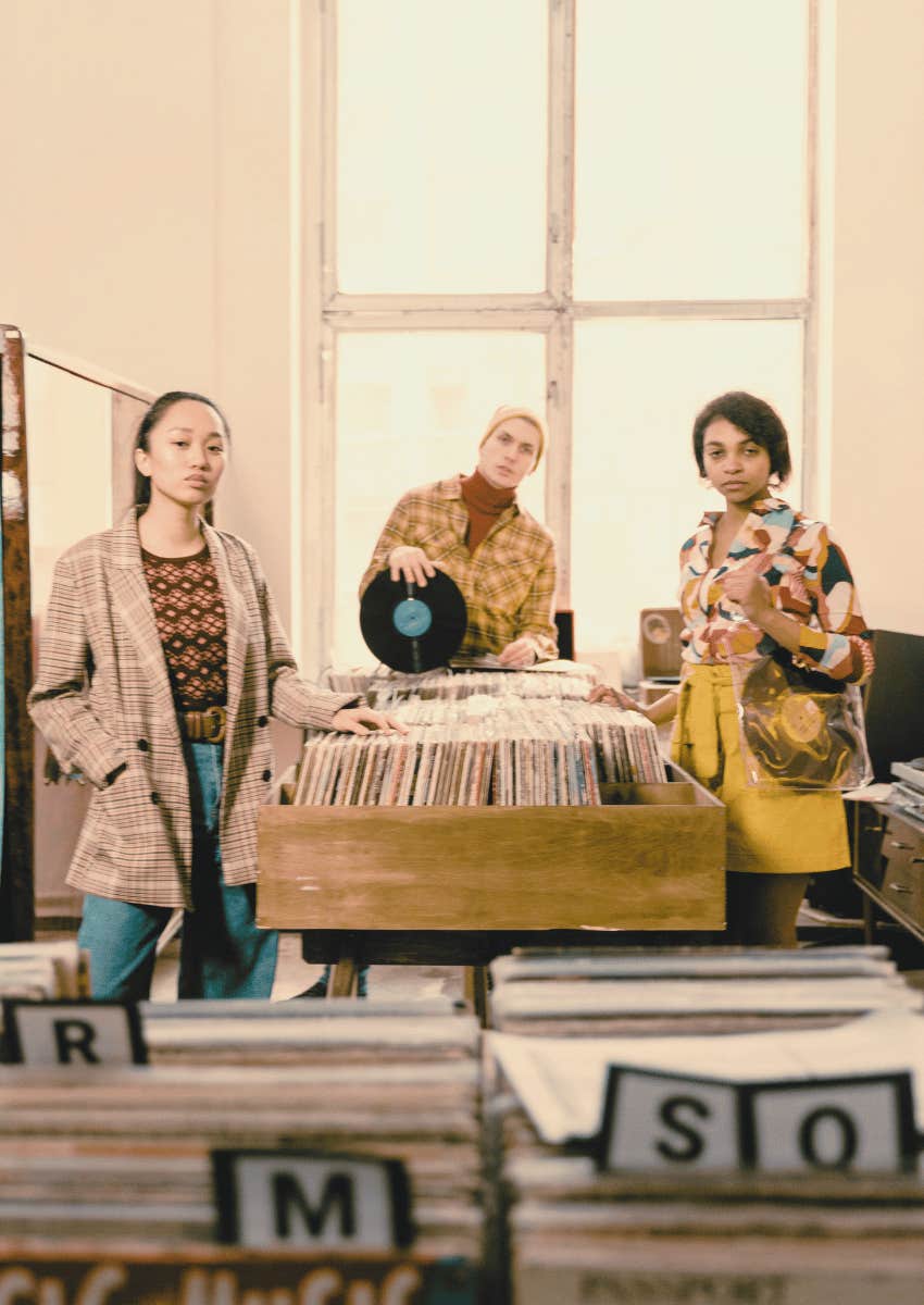 young people standing in a record store