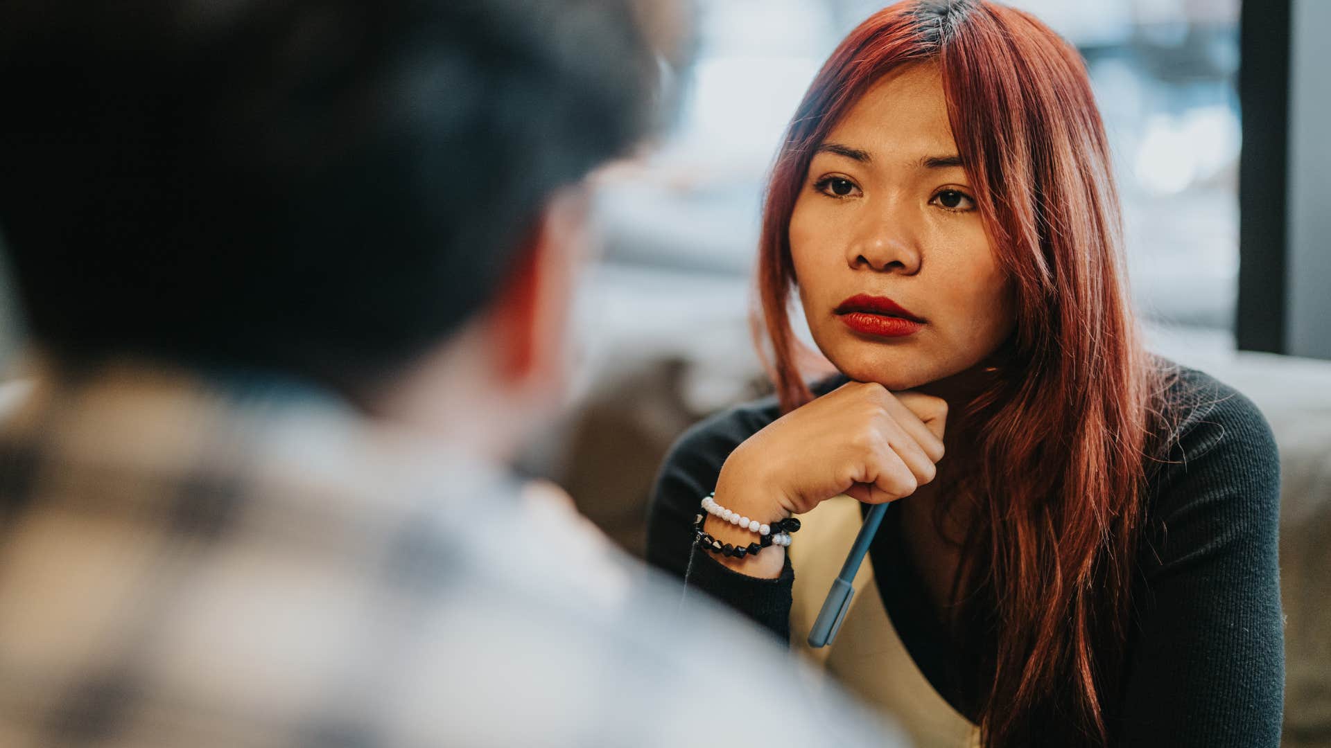 woman staying calm under pressure while talking to friend