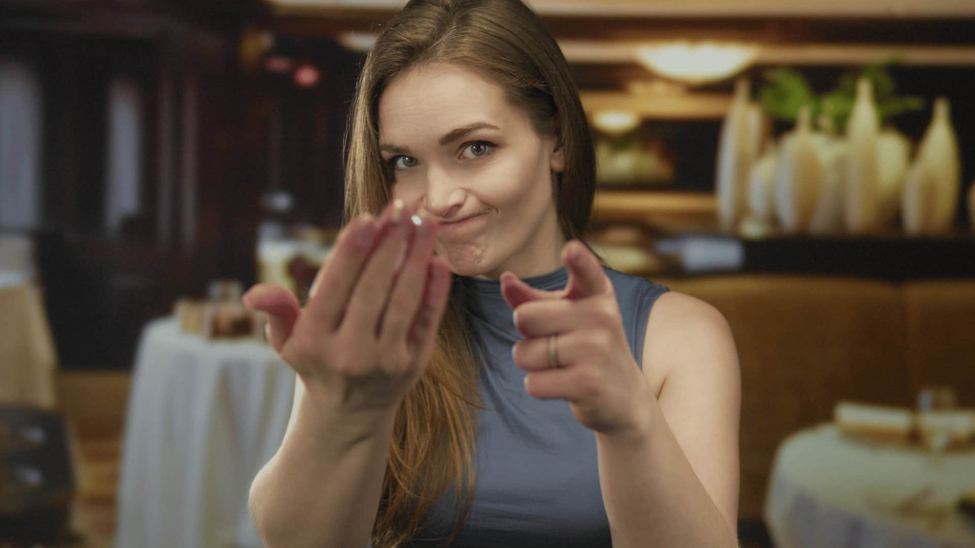 rude customer snapping her fingers to get waiter's attention