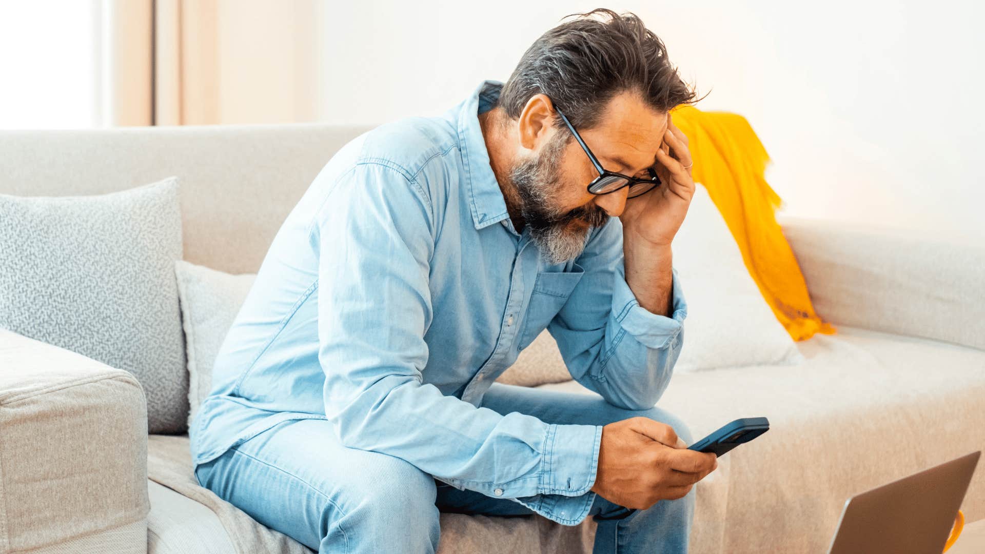 man getting an awkward text from a longtime friend saying works been hectic