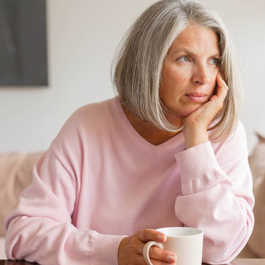 woman carrying guilt about past mistakes thinking deeply